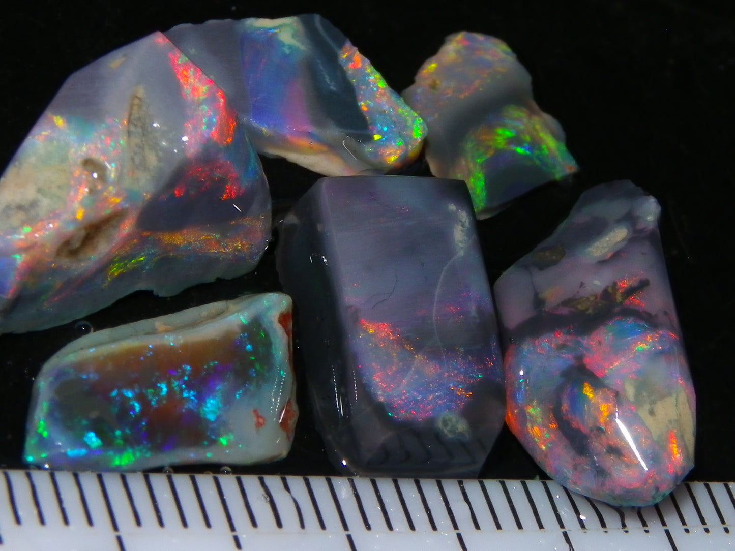 Nice Quality Rubbed Lightning Ridge Opal Parcel 18.04cts Dark Base Reds/Greens