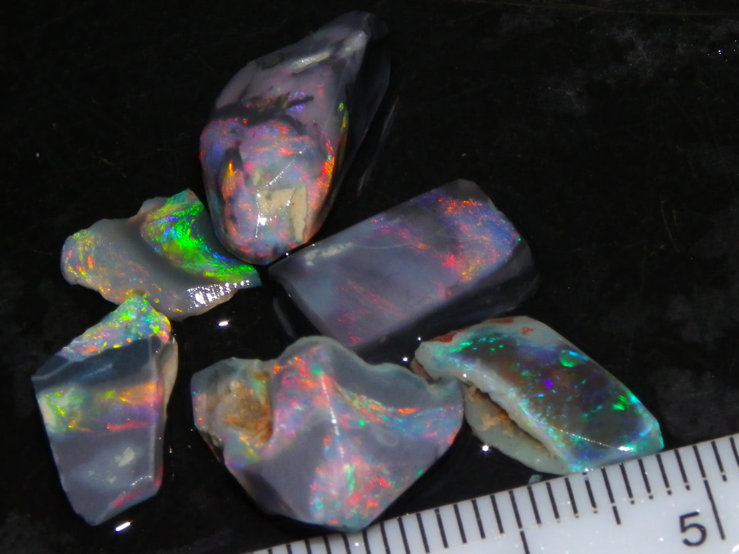 Nice Quality Rubbed Lightning Ridge Opal Parcel 18.04cts Dark Base Reds/Greens