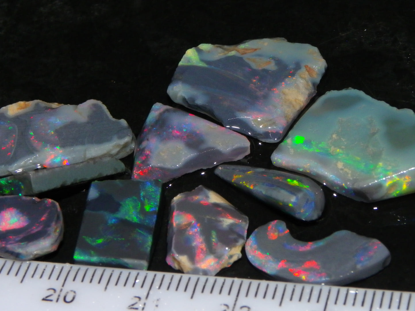 Nice Rough/Rubbed/Sliced Lightning Ridge Opal Parcel 32.9cts Red/Green Fires Dark Base