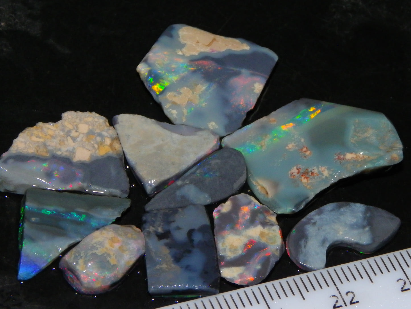 Nice Rough/Rubbed/Sliced Lightning Ridge Opal Parcel 32.9cts Red/Green Fires Dark Base
