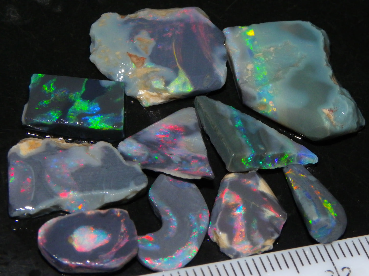 Nice Rough/Rubbed/Sliced Lightning Ridge Opal Parcel 32.9cts Red/Green Fires Dark Base