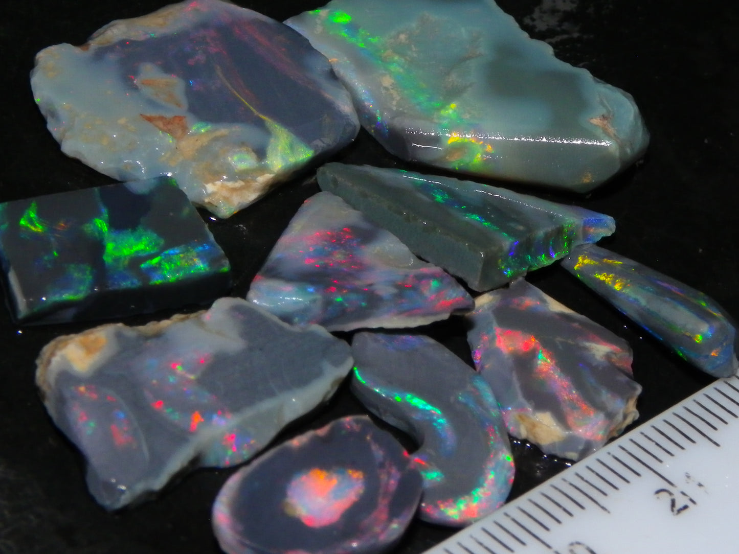 Nice Rough/Rubbed/Sliced Lightning Ridge Opal Parcel 32.9cts Red/Green Fires Dark Base