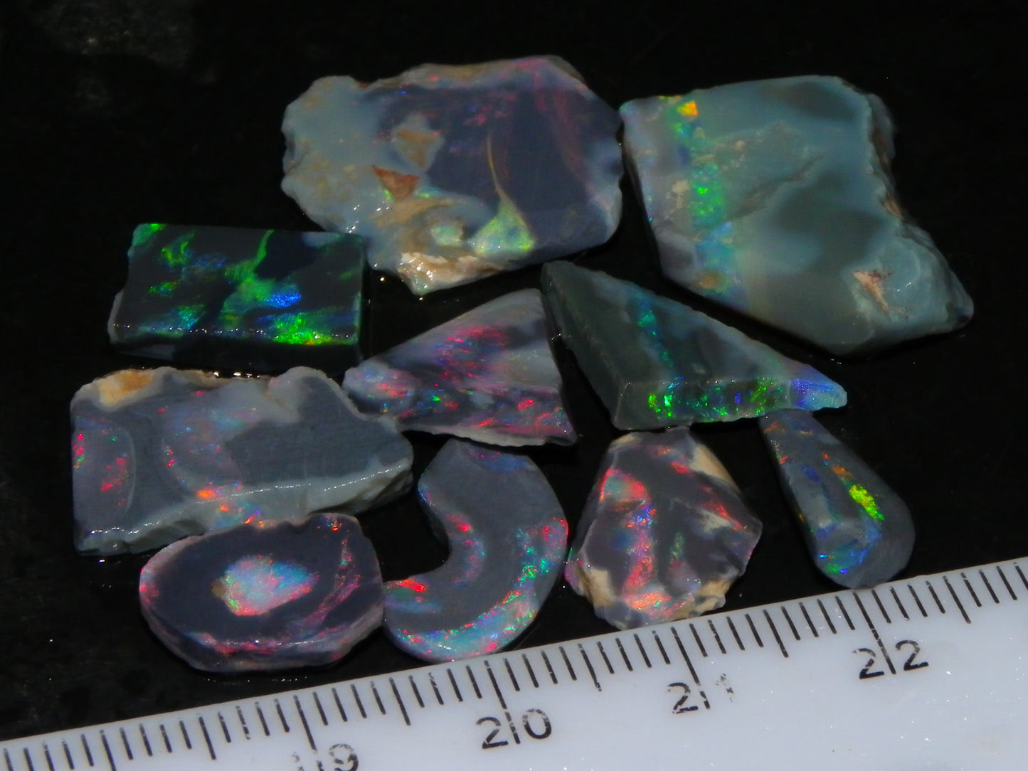 Nice Rough/Rubbed/Sliced Lightning Ridge Opal Parcel 32.9cts Red/Green Fires Dark Base