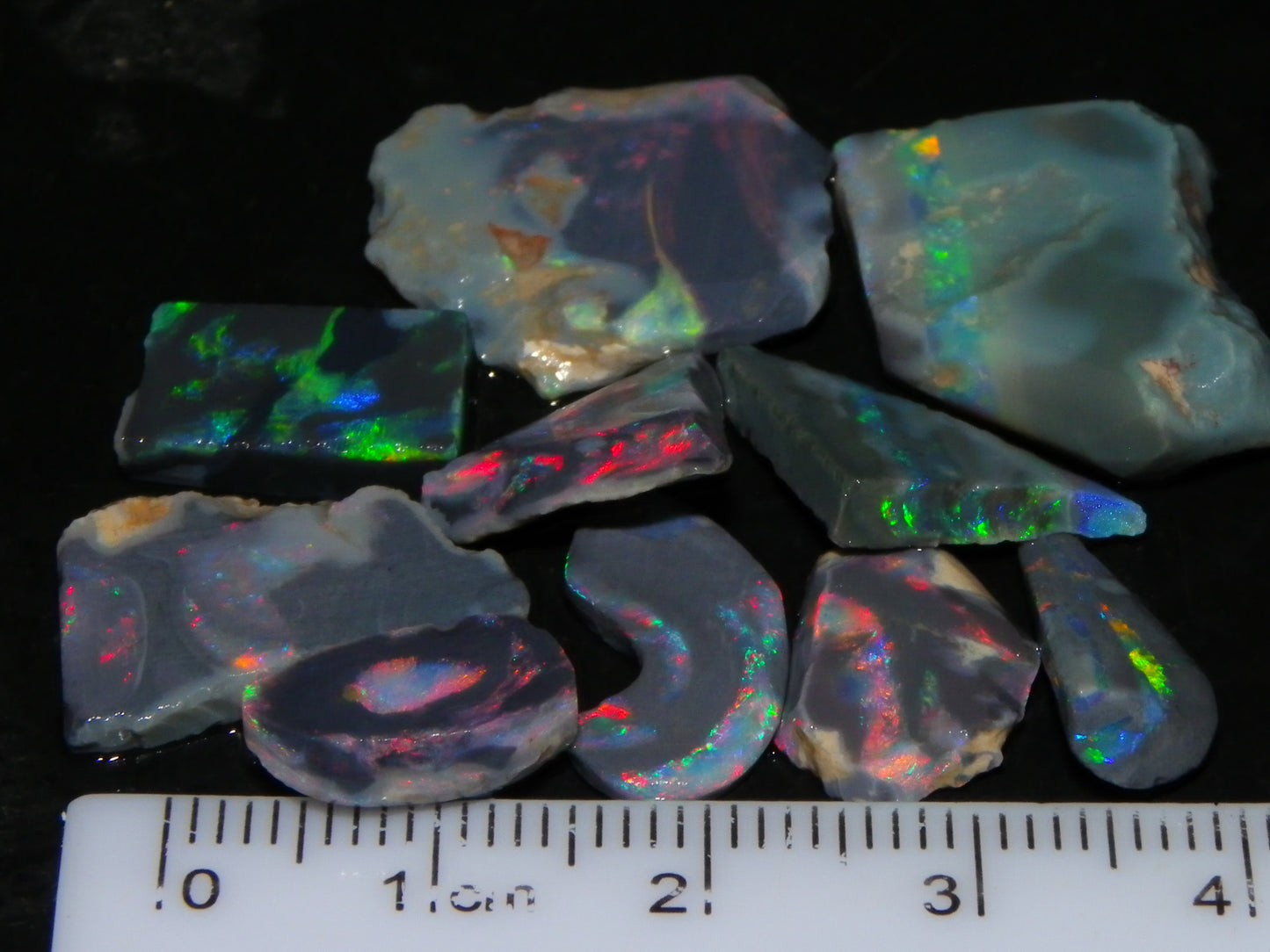 Nice Rough/Rubbed/Sliced Lightning Ridge Opal Parcel 32.9cts Red/Green Fires Dark Base