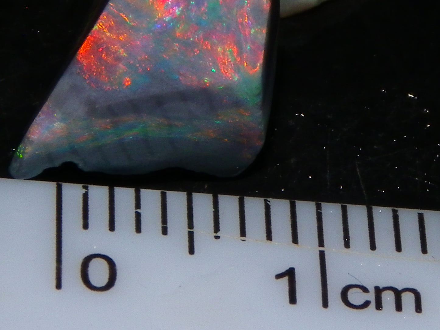 Nice Quality Rubbed Lightning Ridge Opal Parcel 18.04cts Dark Base Reds/Greens