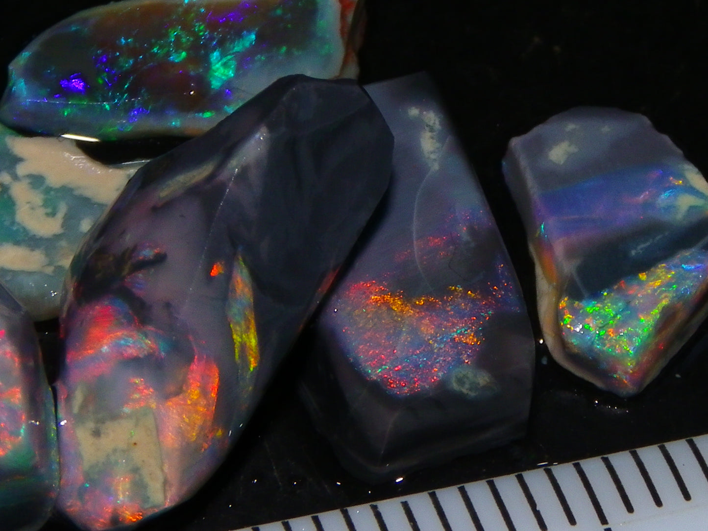 Nice Quality Rubbed Lightning Ridge Opal Parcel 18.04cts Dark Base Reds/Greens