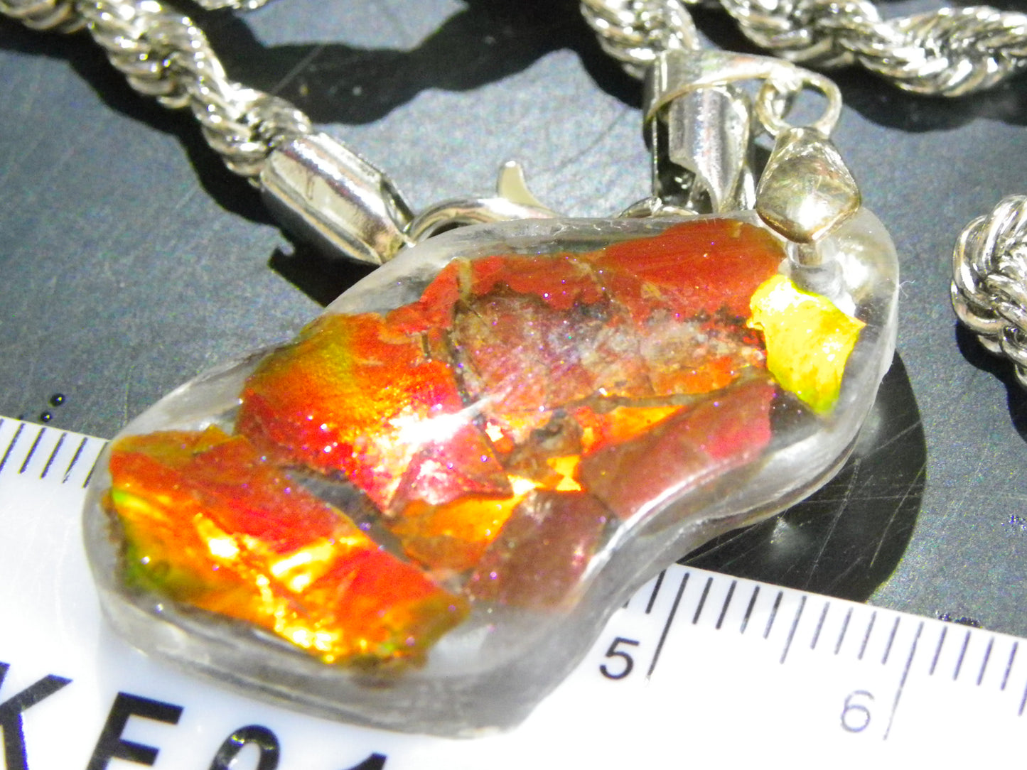 Nice Red/Orange Ammolite + resin Pendant 24cts ex Titanium Chain Bright Colours Alberta Canada