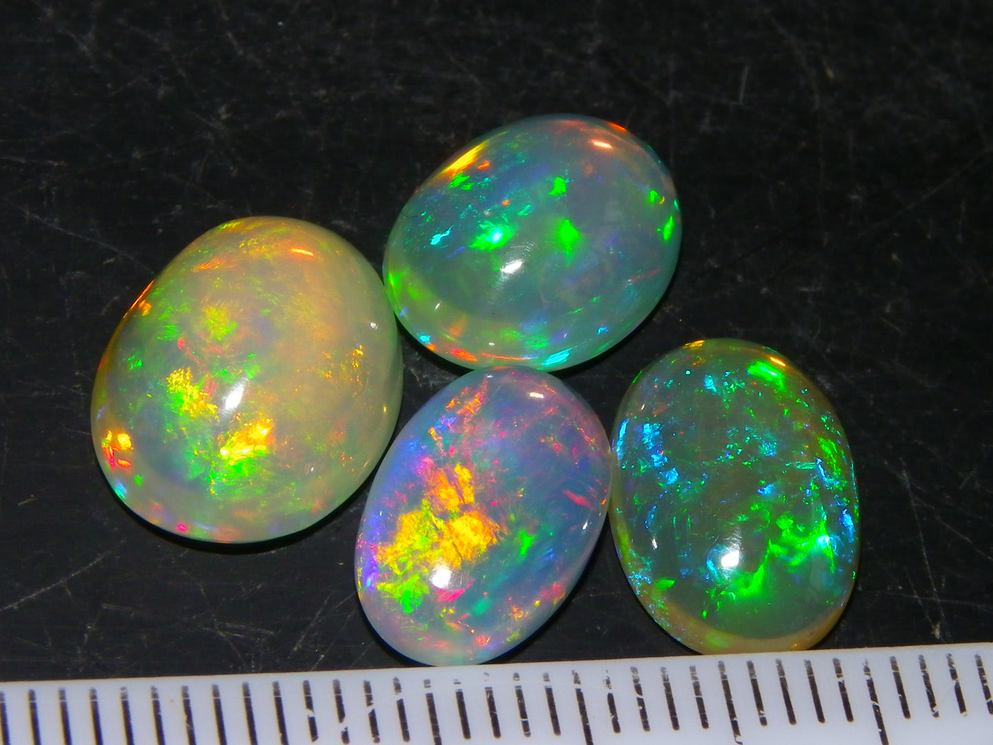 4 Nice Quality Ethiopian Welo Opal Cabs 10.5cts Multicolour Fires Green/Red/Blues