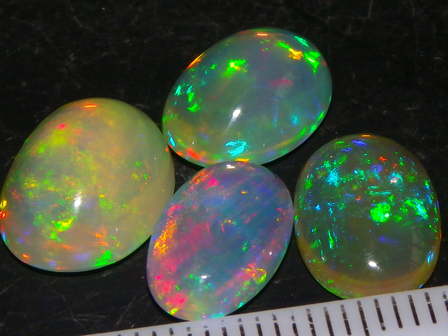 4 Nice Quality Ethiopian Welo Opal Cabs 10.5cts Multicolour Fires Green/Red/Blues