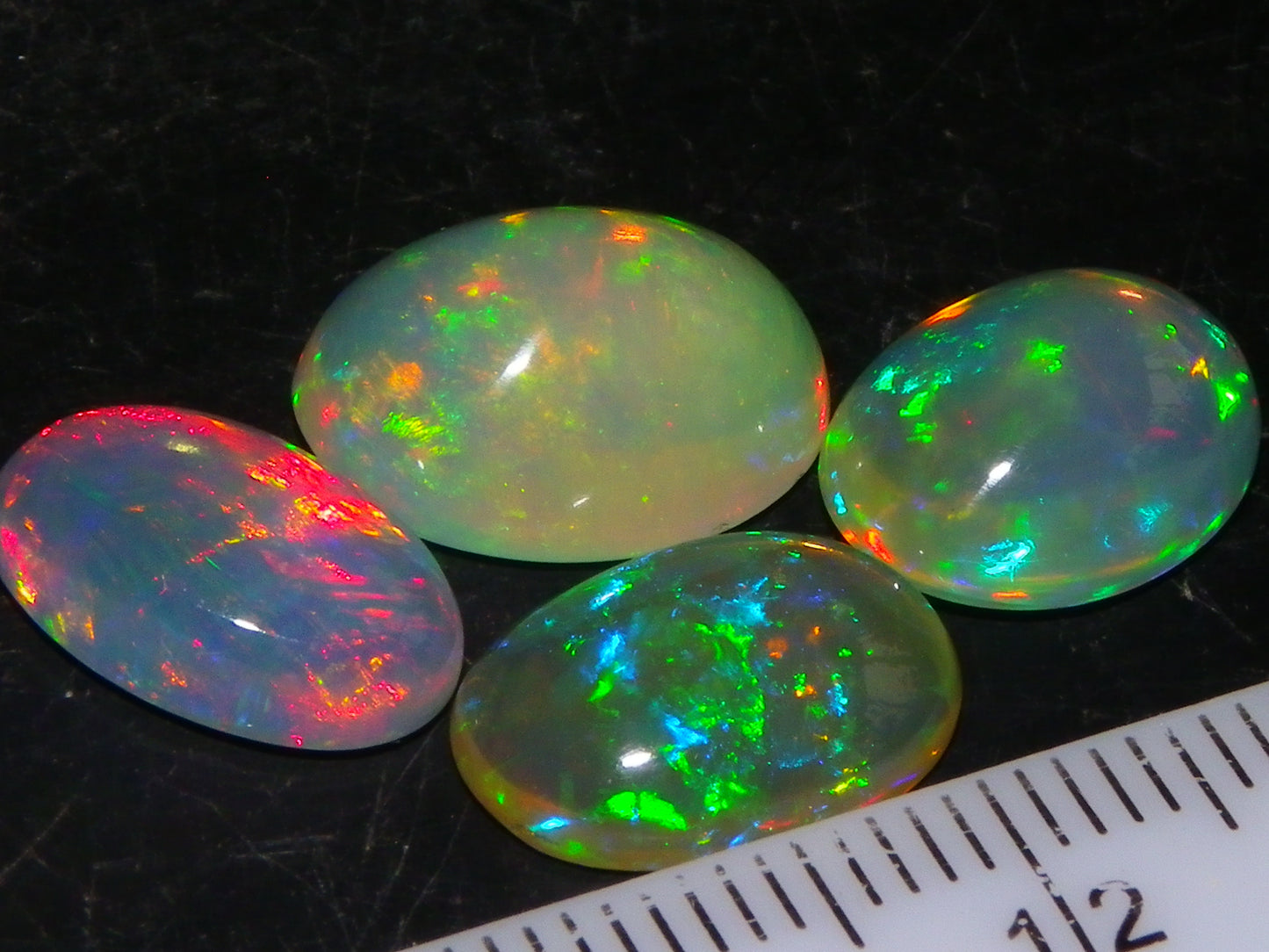 4 Nice Quality Ethiopian Welo Opal Cabs 10.5cts Multicolour Fires Green/Red/Blues