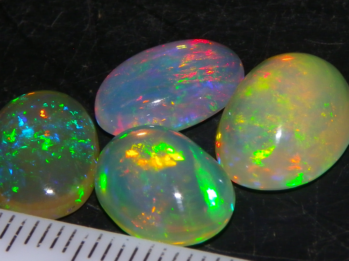 4 Nice Quality Ethiopian Welo Opal Cabs 10.5cts Multicolour Fires Green/Red/Blues