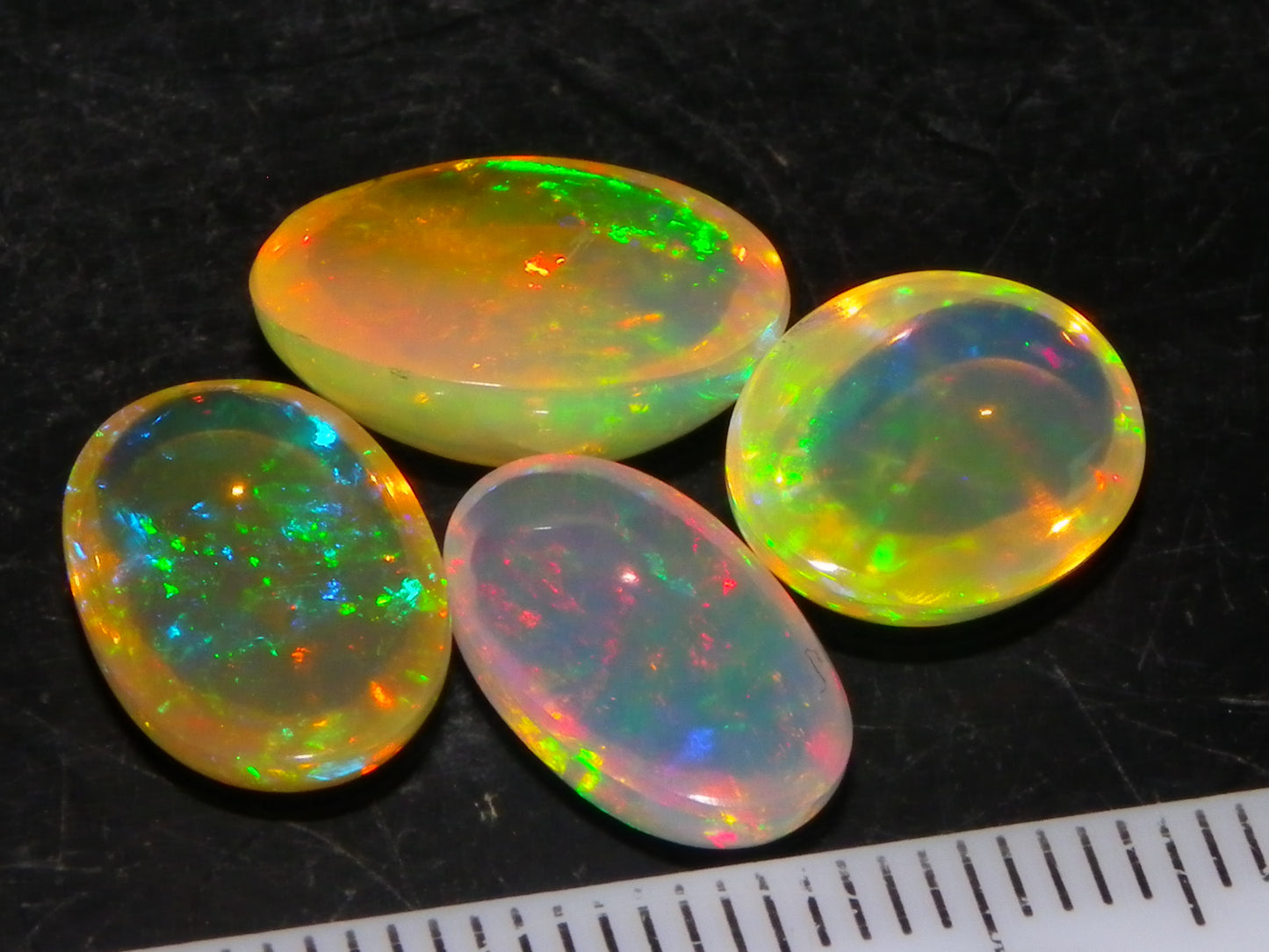 4 Nice Quality Ethiopian Welo Opal Cabs 10.5cts Multicolour Fires Green/Red/Blues