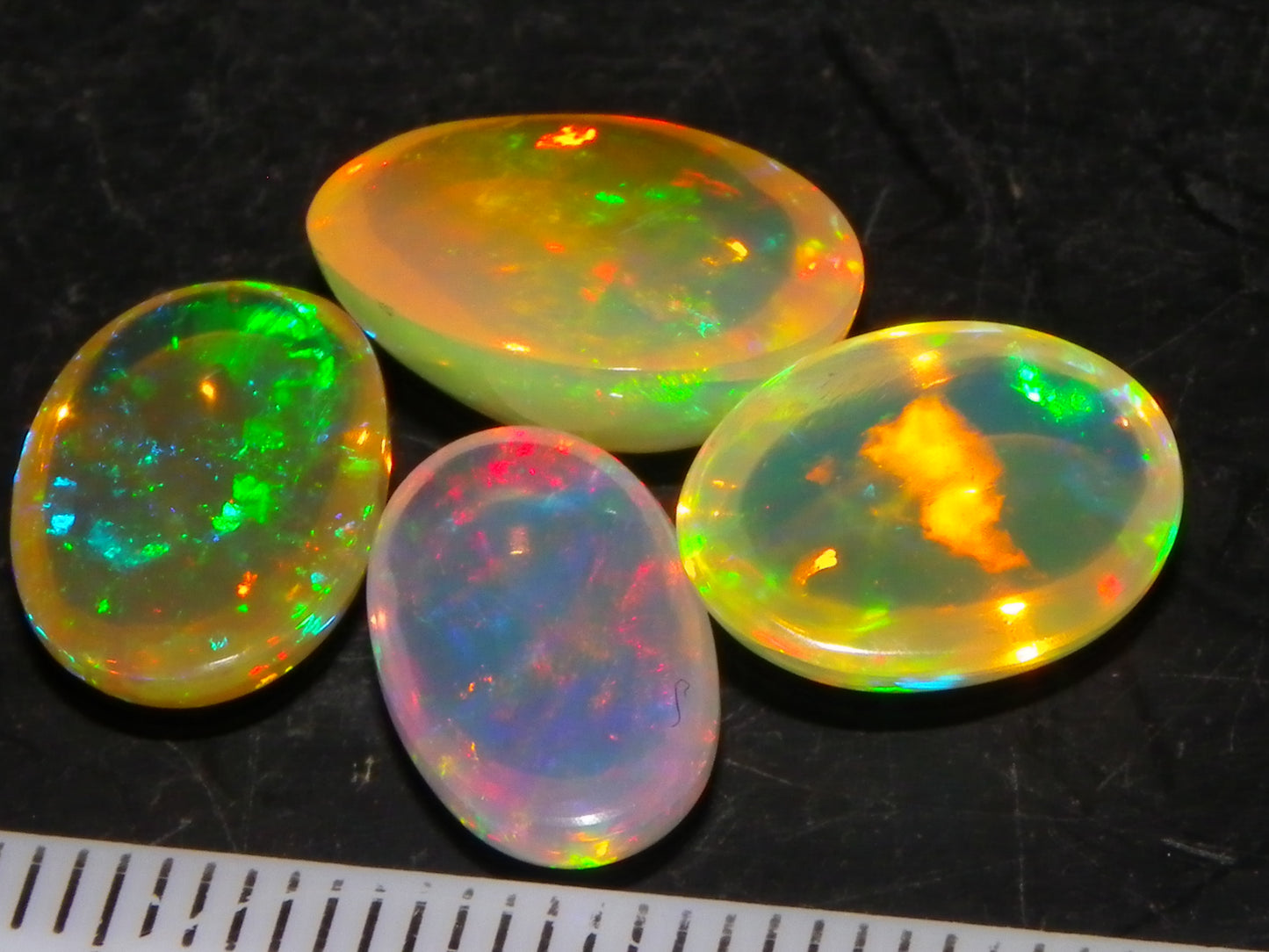 4 Nice Quality Ethiopian Welo Opal Cabs 10.5cts Multicolour Fires Green/Red/Blues