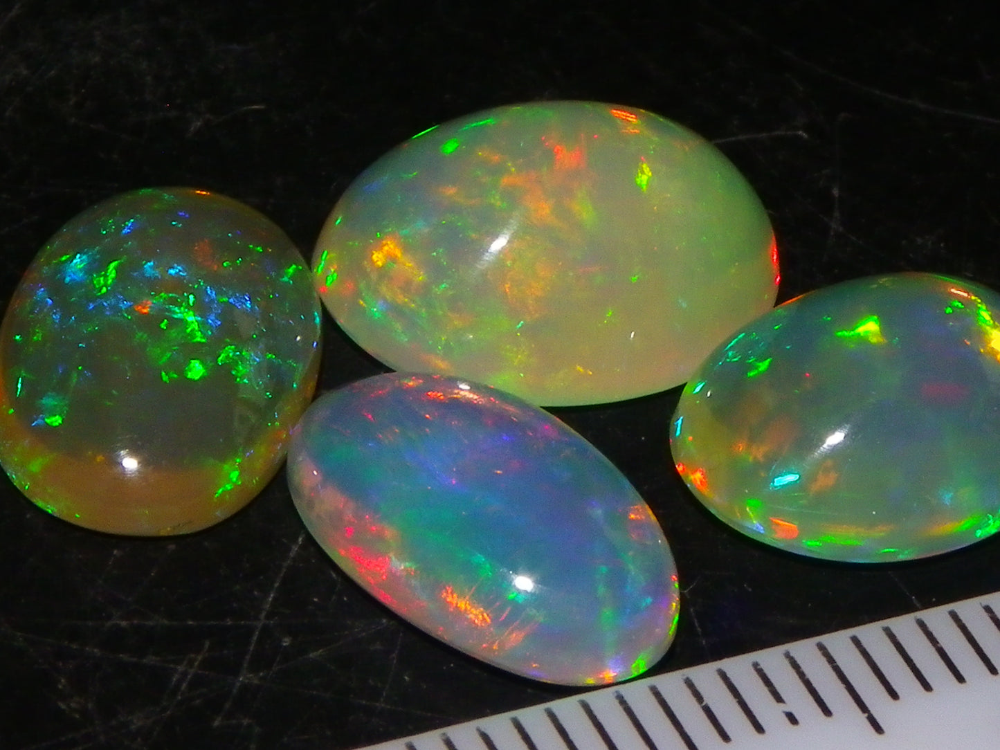 4 Nice Quality Ethiopian Welo Opal Cabs 10.5cts Multicolour Fires Green/Red/Blues