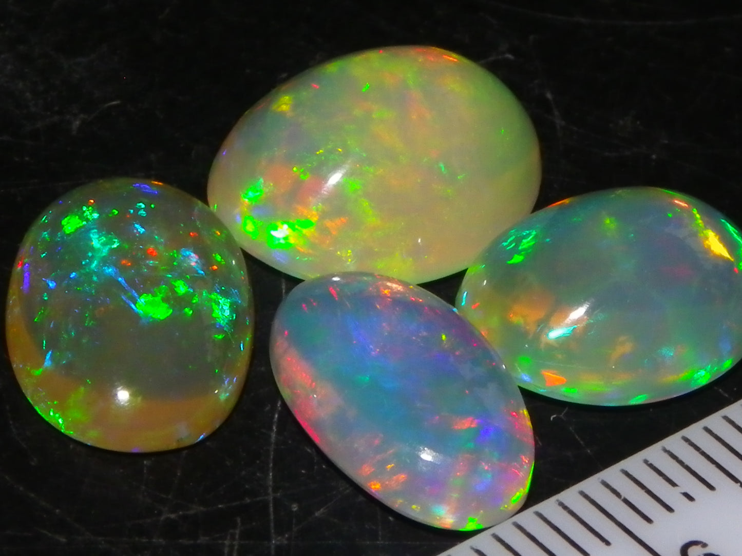 4 Nice Quality Ethiopian Welo Opal Cabs 10.5cts Multicolour Fires Green/Red/Blues