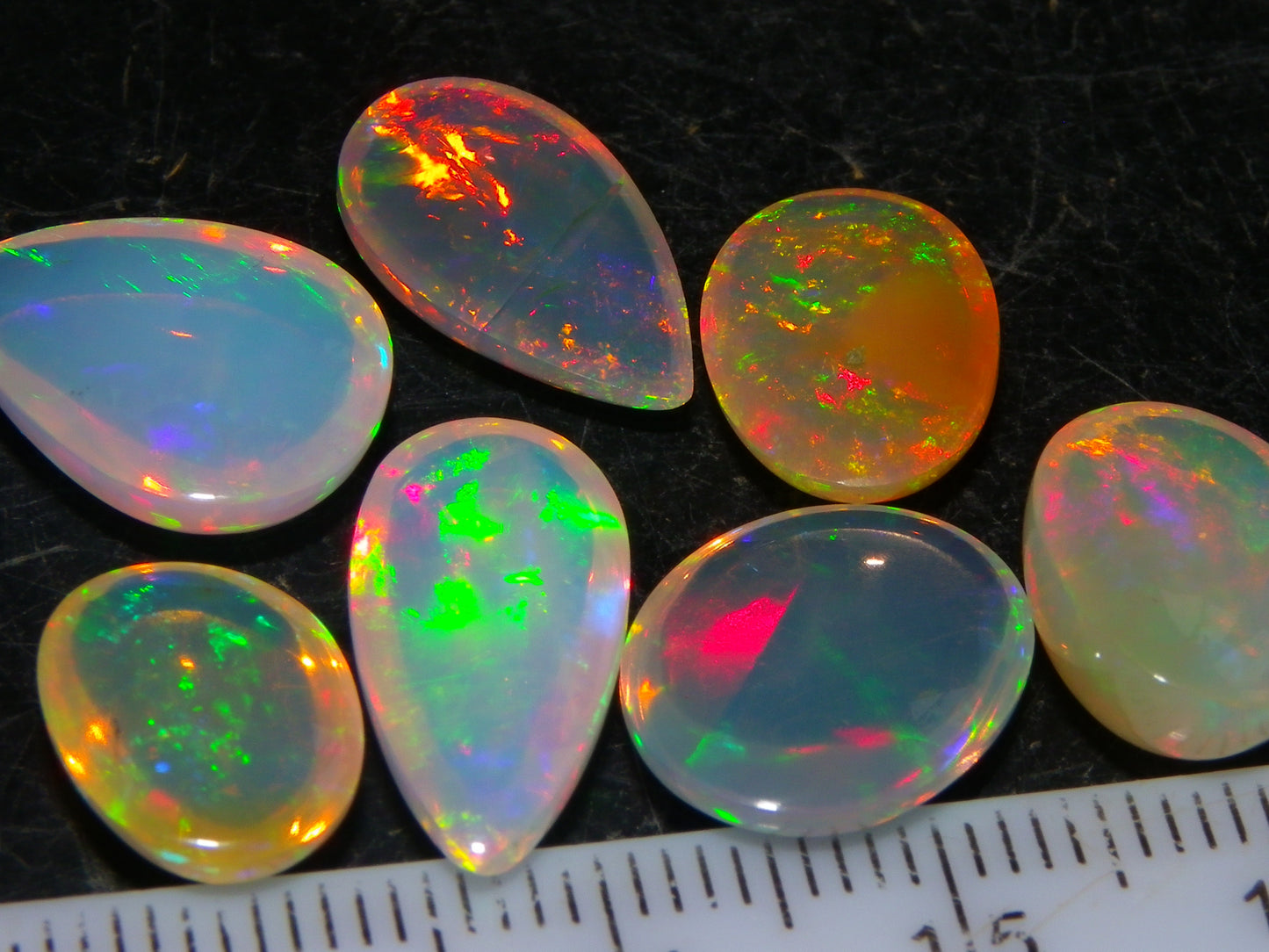 7 Nice Welo Crystal Opal Cabs 20.78cts Multicolour Fires Ethiopia
