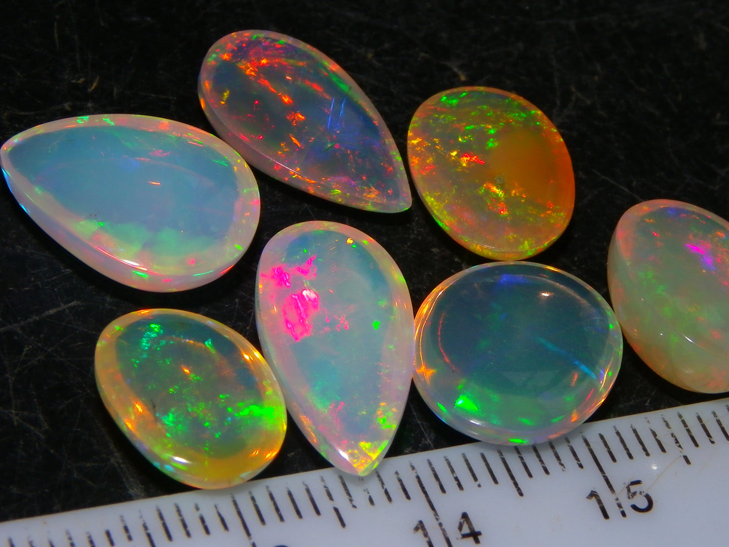 7 Nice Welo Crystal Opal Cabs 20.78cts Multicolour Fires Ethiopia