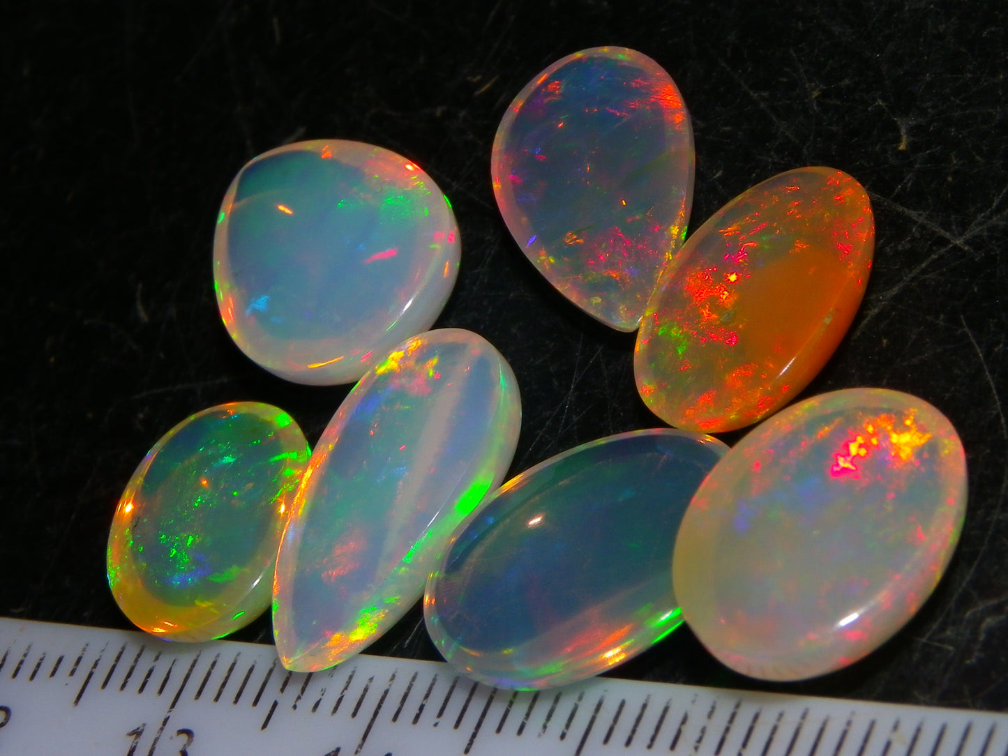 7 Nice Welo Crystal Opal Cabs 20.78cts Multicolour Fires Ethiopia