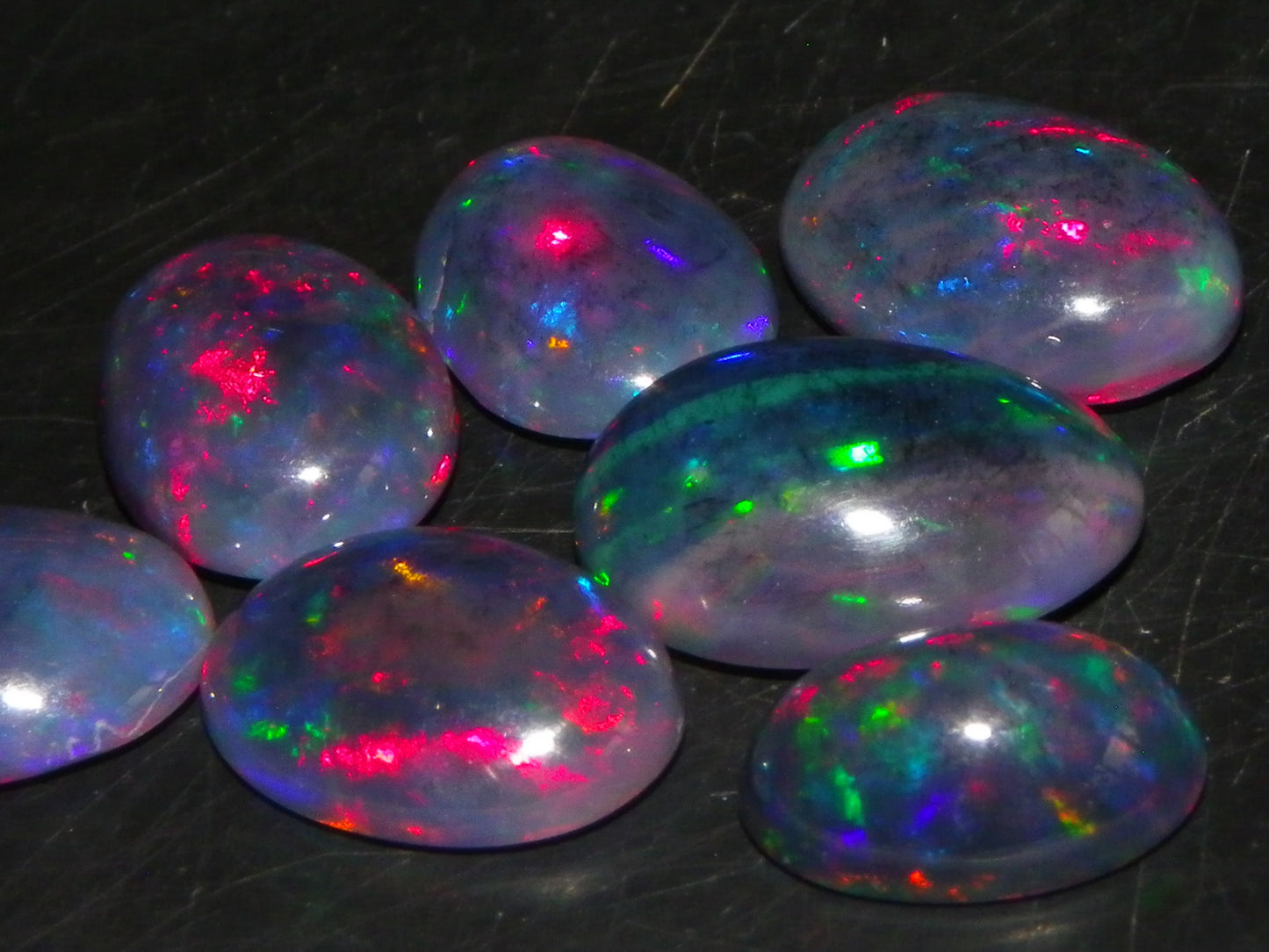 7 Nice Cut/Polished/Treated Welo Crystal Opal Cabs 15.45cts red/Green Fires Ethiopia