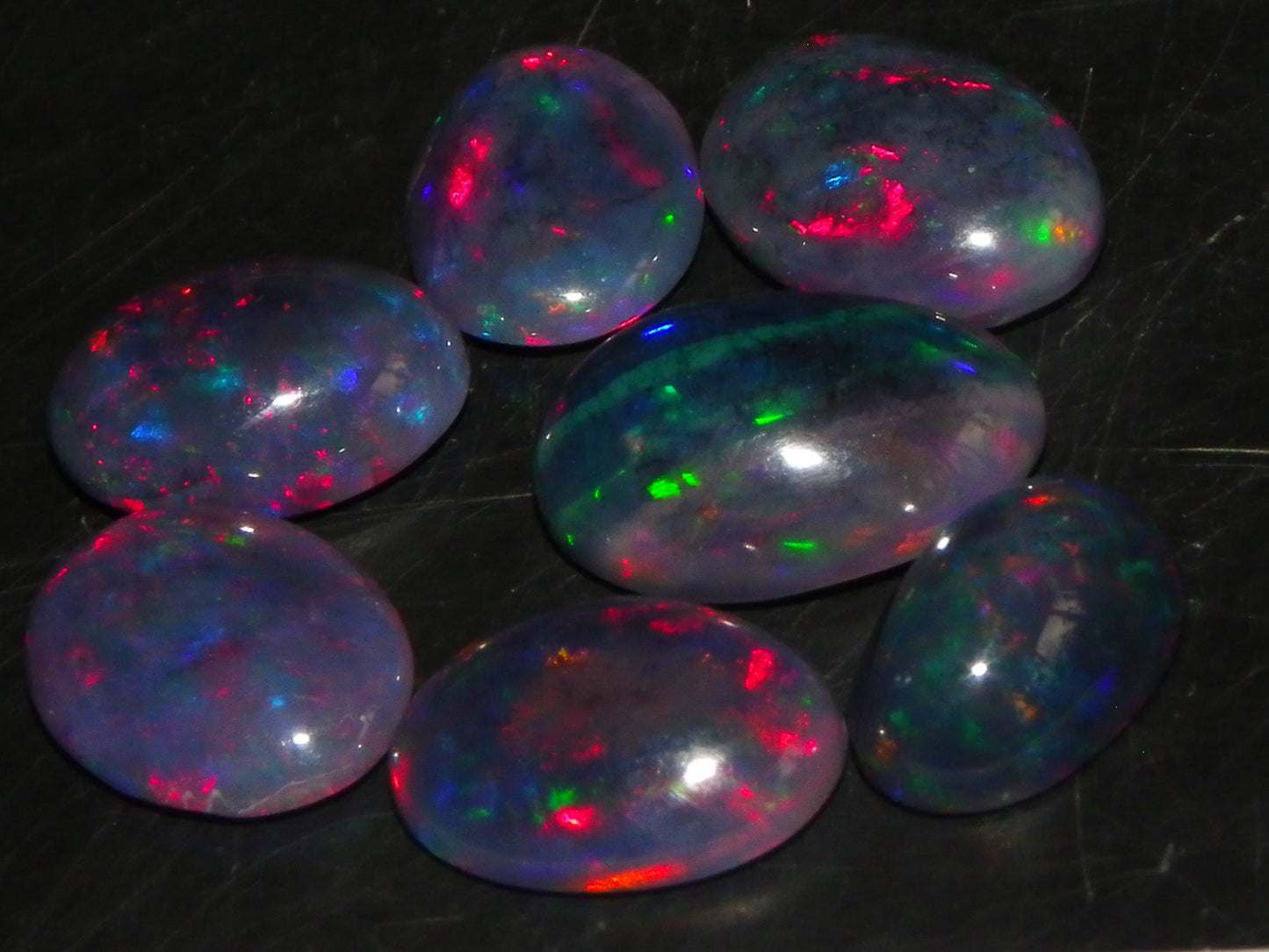 7 Nice Cut/Polished/Treated Welo Crystal Opal Cabs 15.45cts red/Green Fires Ethiopia