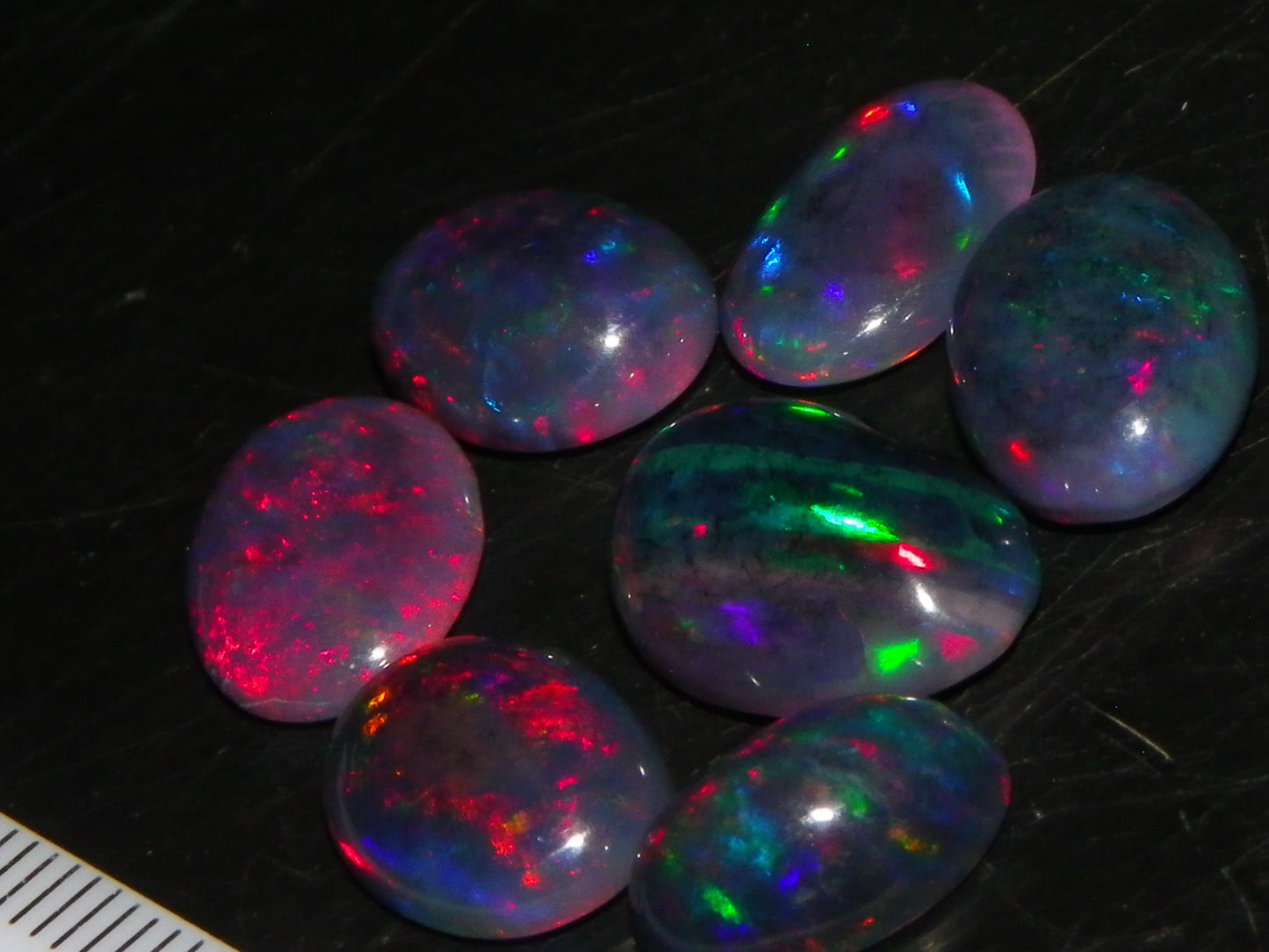 7 Nice Cut/Polished/Treated Welo Crystal Opal Cabs 15.45cts red/Green Fires Ethiopia