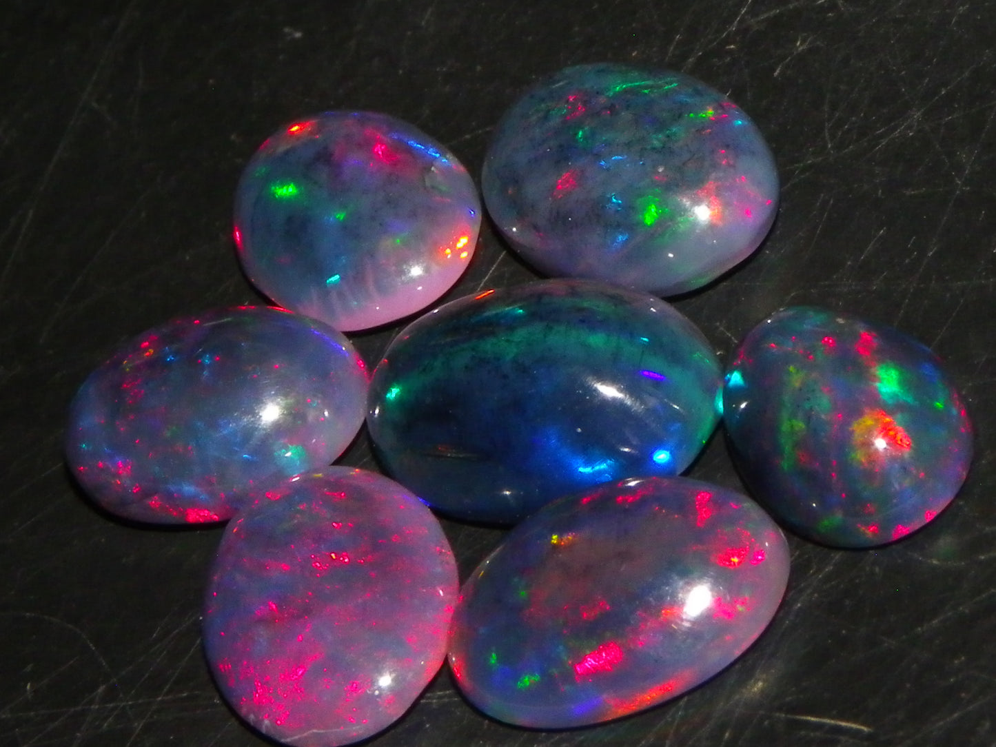 7 Nice Cut/Polished/Treated Welo Crystal Opal Cabs 15.45cts red/Green Fires Ethiopia