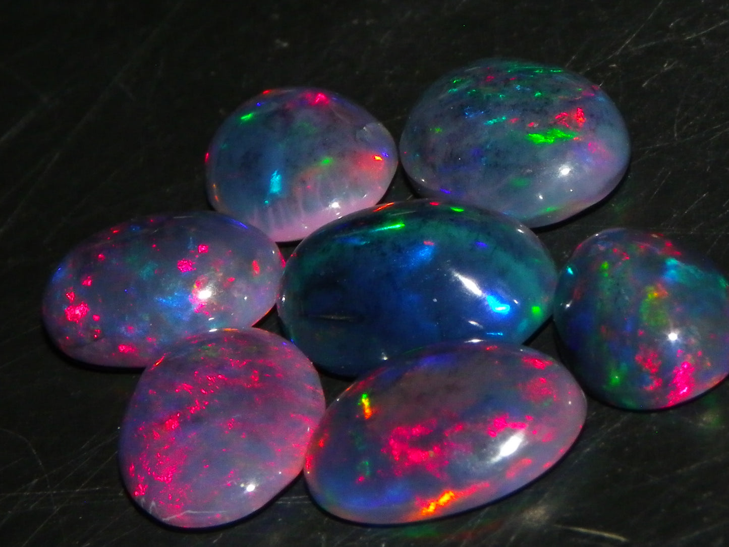 7 Nice Cut/Polished/Treated Welo Crystal Opal Cabs 15.45cts red/Green Fires Ethiopia