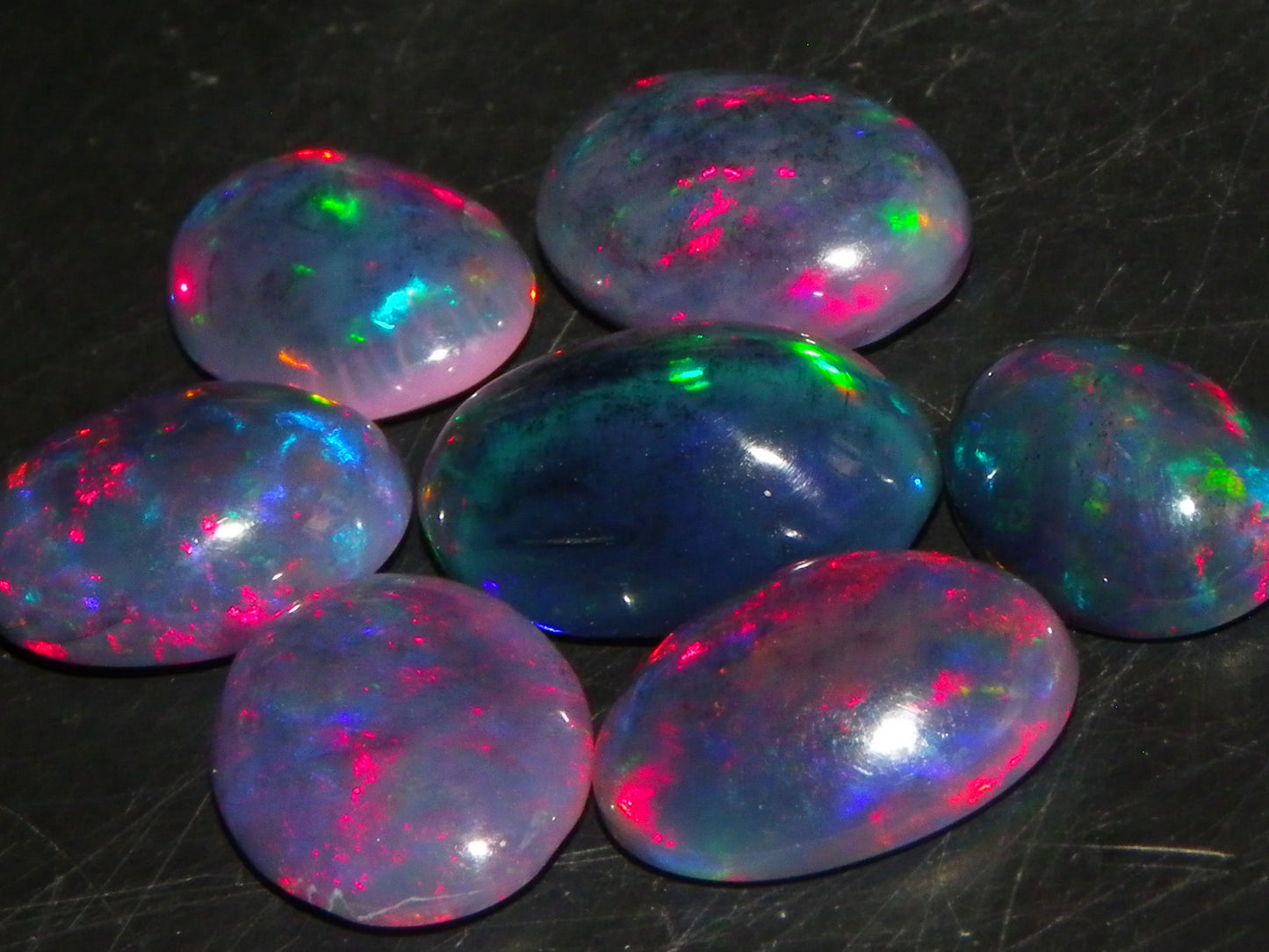 7 Nice Cut/Polished/Treated Welo Crystal Opal Cabs 15.45cts red/Green Fires Ethiopia