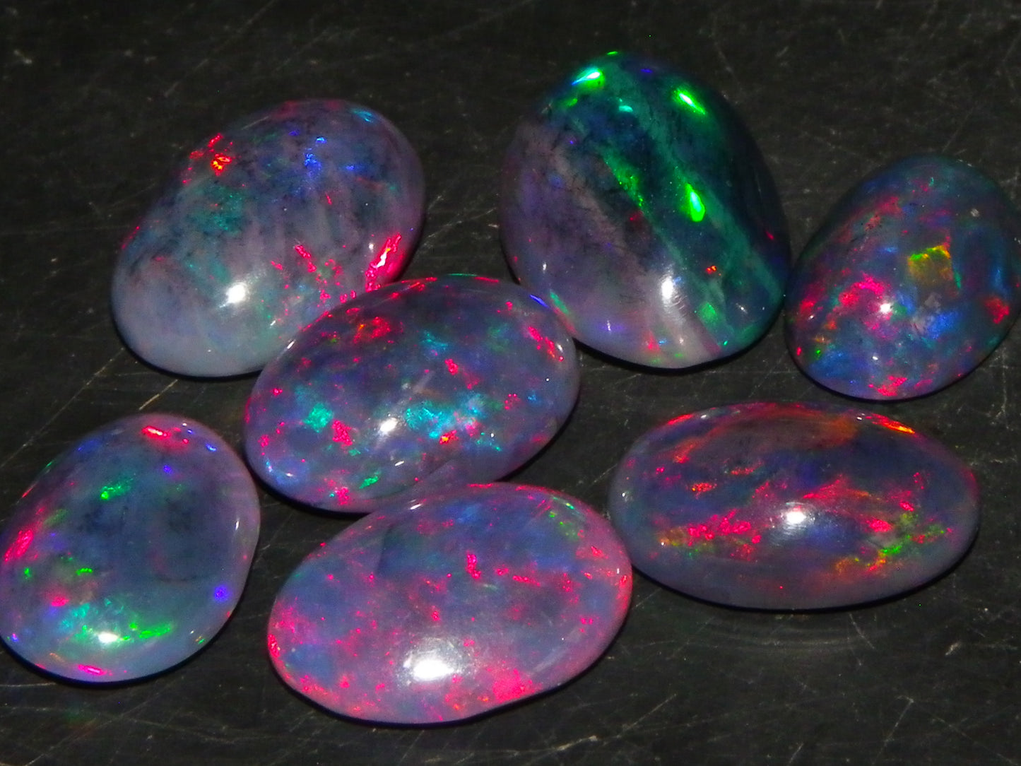 7 Nice Cut/Polished/Treated Welo Crystal Opal Cabs 15.45cts red/Green Fires Ethiopia