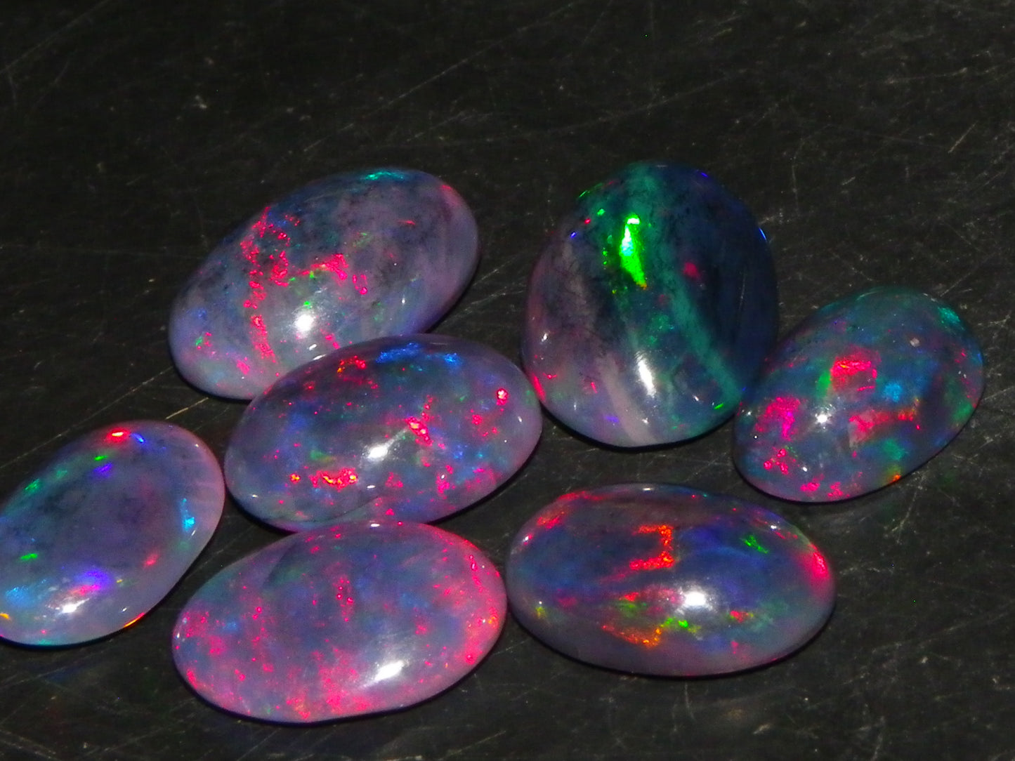 7 Nice Cut/Polished/Treated Welo Crystal Opal Cabs 15.45cts red/Green Fires Ethiopia