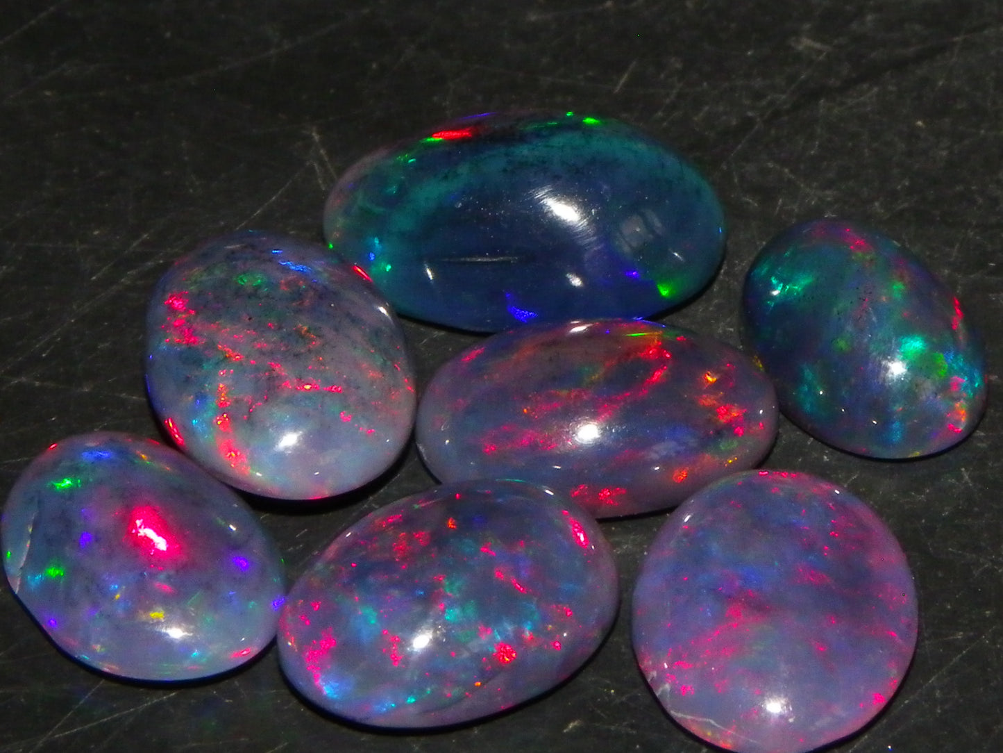 7 Nice Cut/Polished/Treated Welo Crystal Opal Cabs 15.45cts red/Green Fires Ethiopia