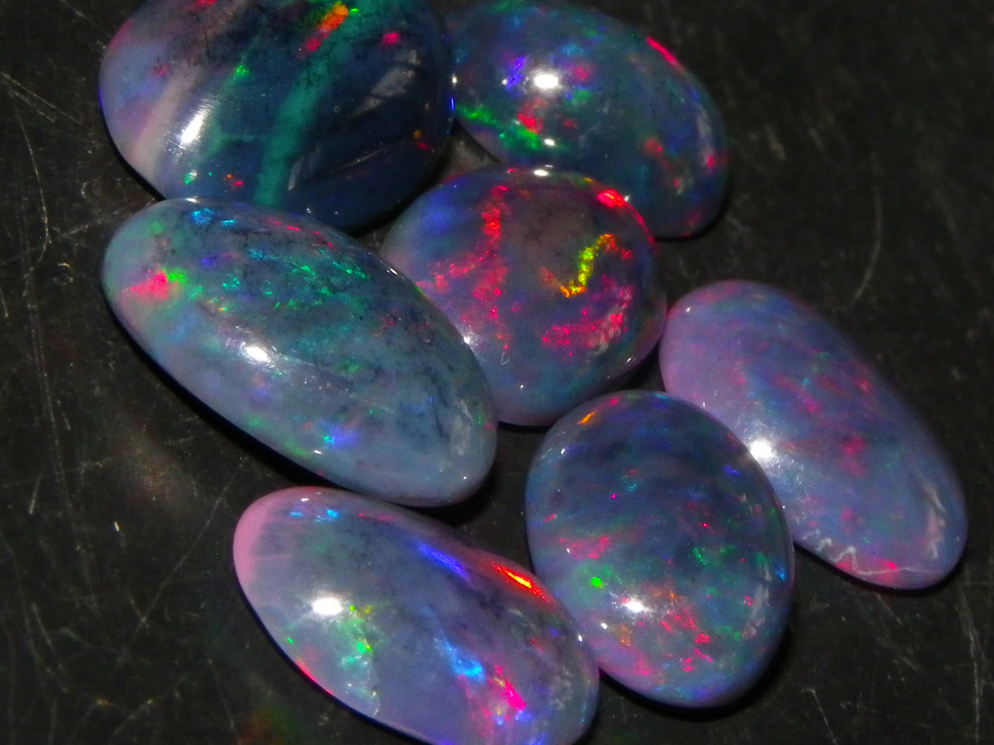 7 Nice Cut/Polished/Treated Welo Crystal Opal Cabs 15.45cts red/Green Fires Ethiopia