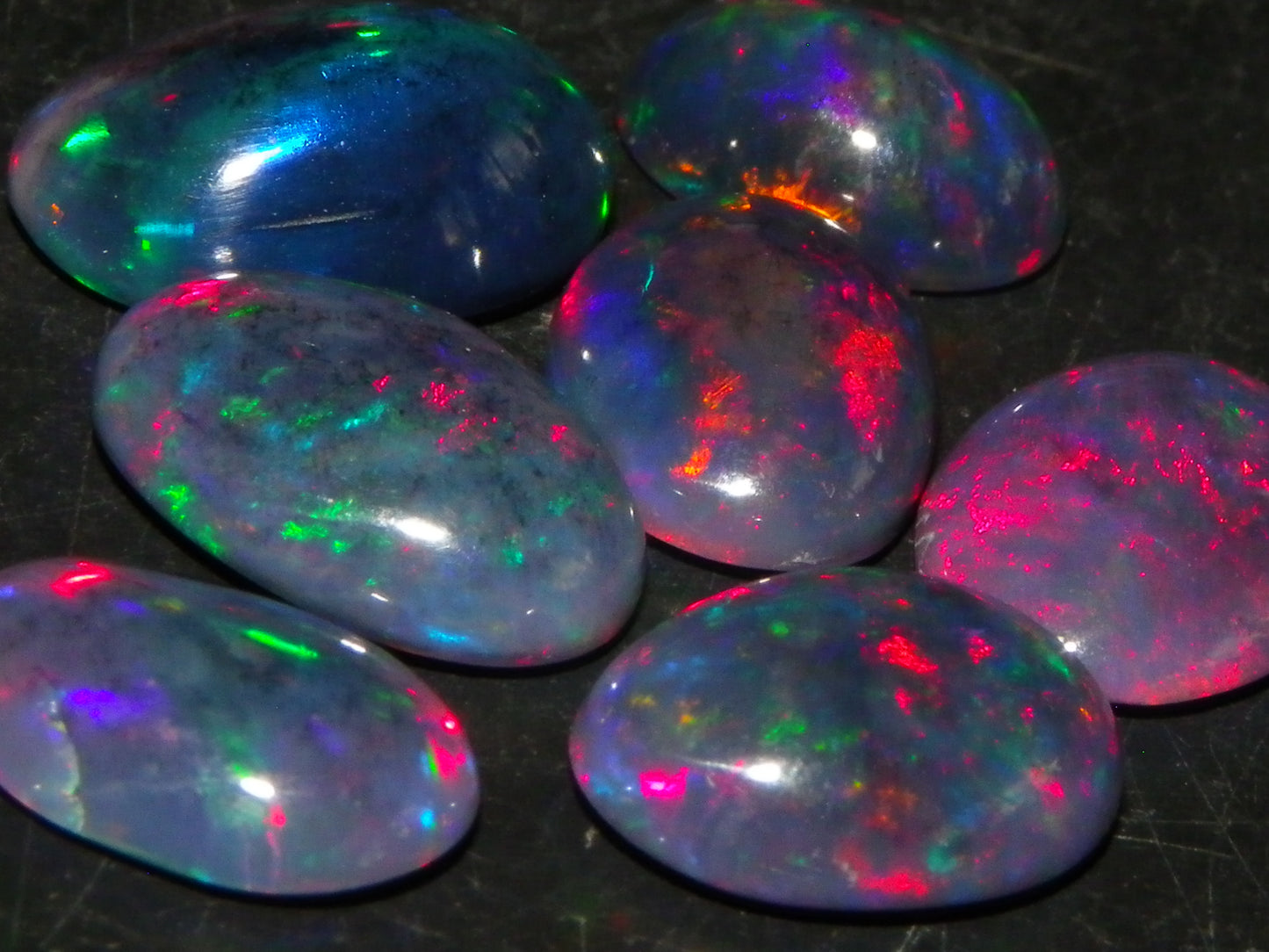 7 Nice Cut/Polished/Treated Welo Crystal Opal Cabs 15.45cts red/Green Fires Ethiopia