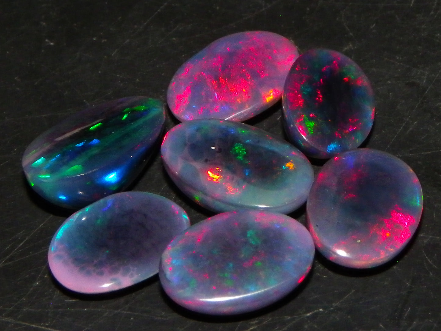 7 Nice Cut/Polished/Treated Welo Crystal Opal Cabs 15.45cts red/Green Fires Ethiopia