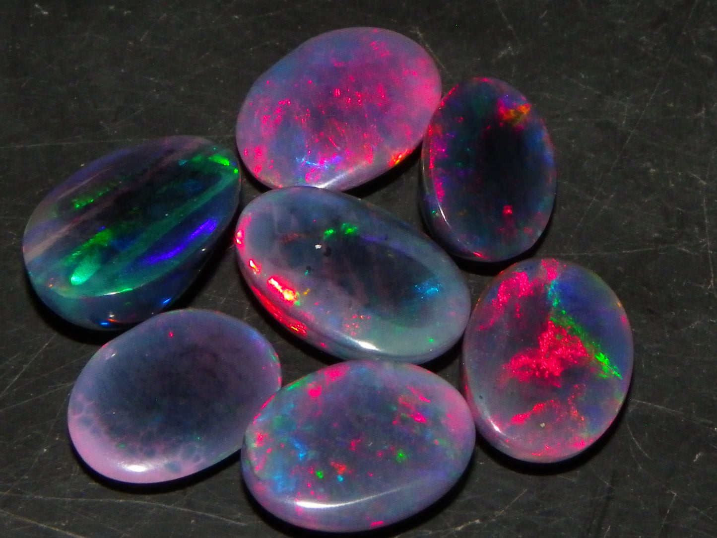 7 Nice Cut/Polished/Treated Welo Crystal Opal Cabs 15.45cts red/Green Fires Ethiopia