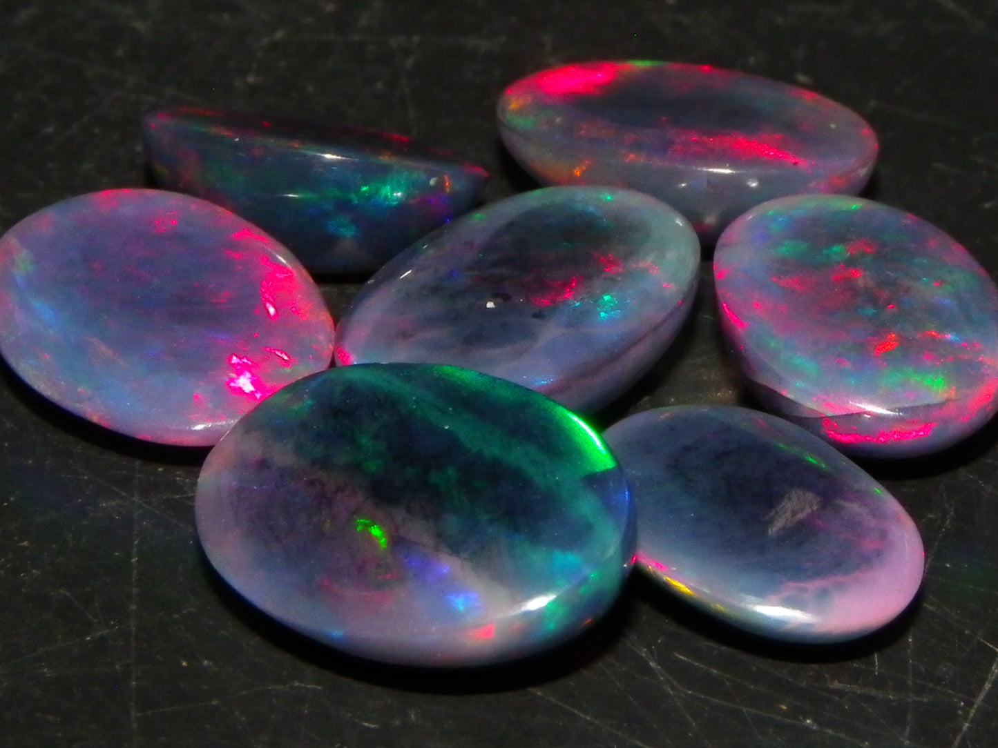 7 Nice Cut/Polished/Treated Welo Crystal Opal Cabs 15.45cts red/Green Fires Ethiopia