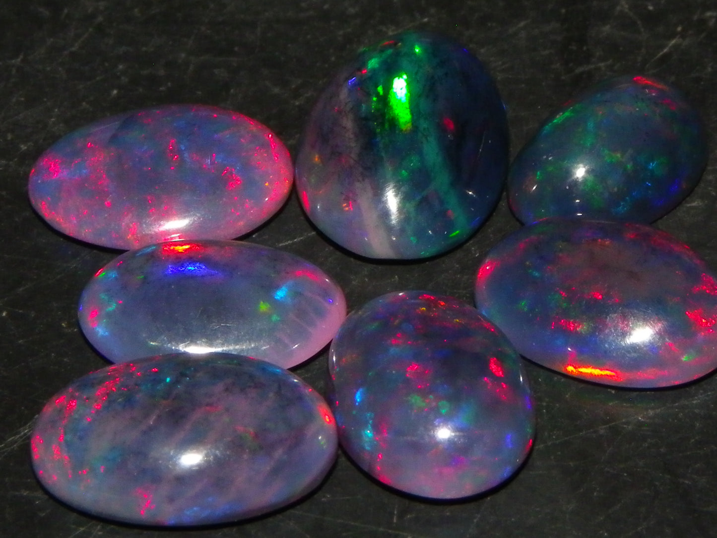 7 Nice Cut/Polished/Treated Welo Crystal Opal Cabs 15.45cts red/Green Fires Ethiopia