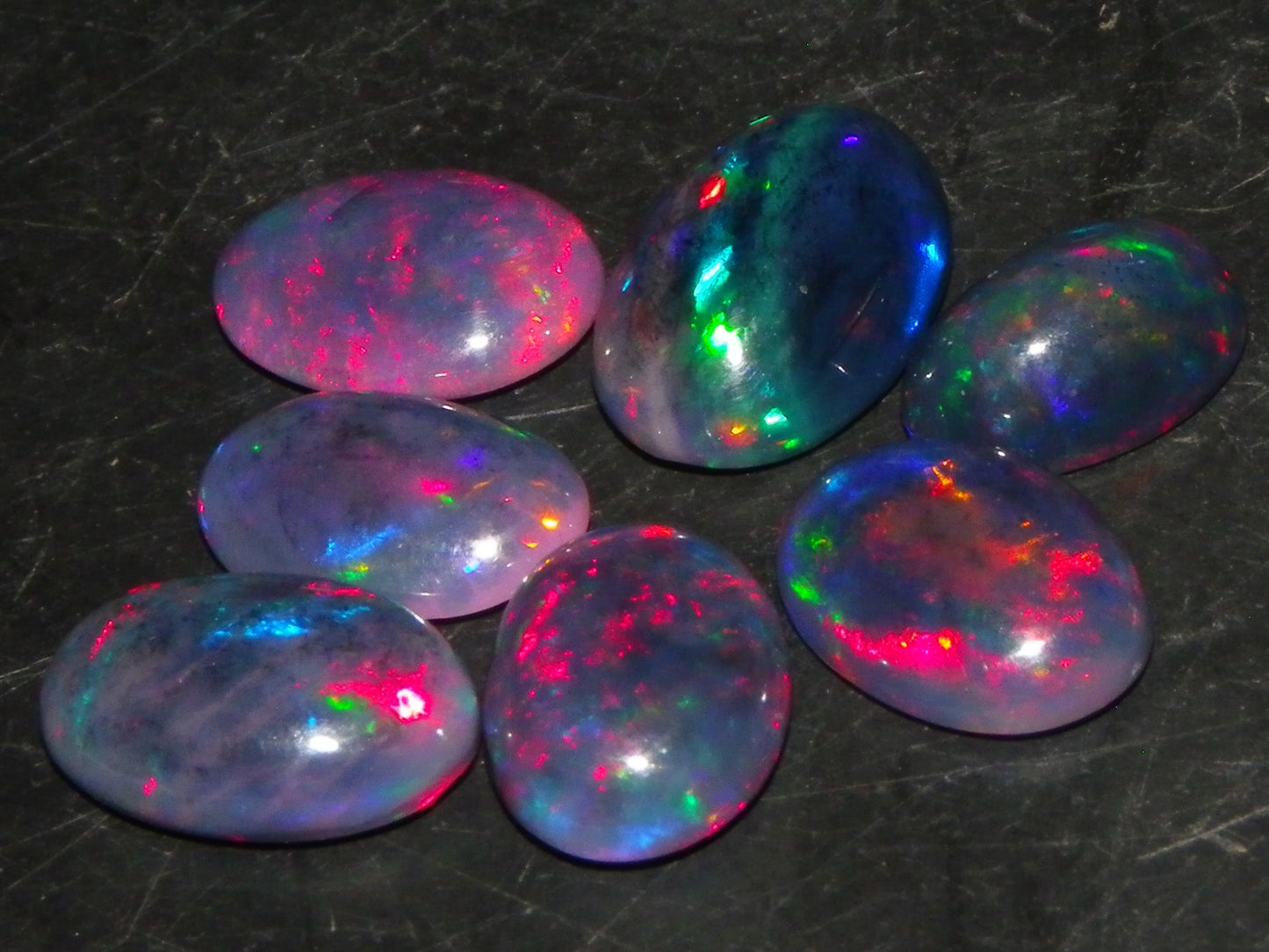 7 Nice Cut/Polished/Treated Welo Crystal Opal Cabs 15.45cts red/Green Fires Ethiopia