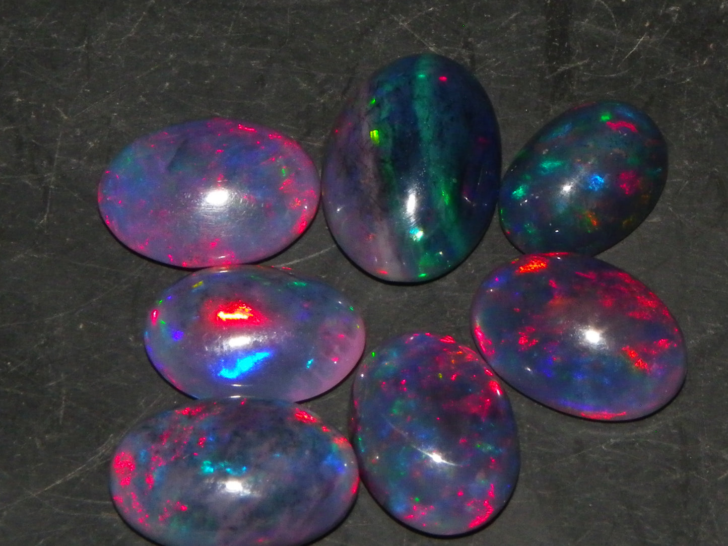 7 Nice Cut/Polished/Treated Welo Crystal Opal Cabs 15.45cts red/Green Fires Ethiopia