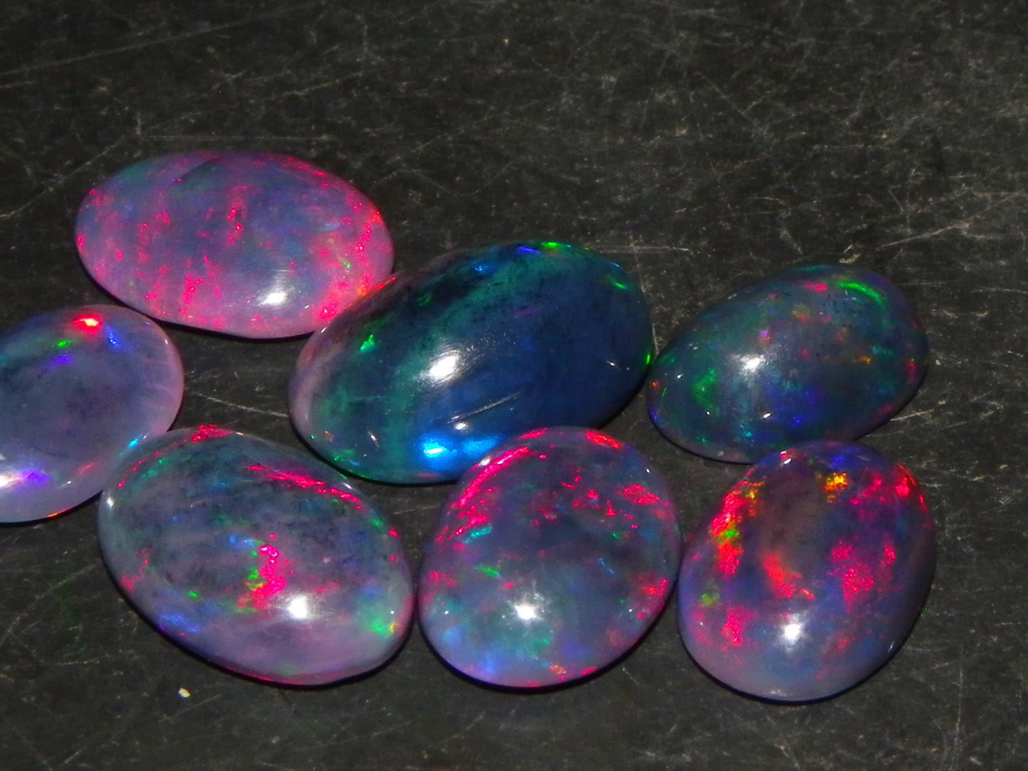 7 Nice Cut/Polished/Treated Welo Crystal Opal Cabs 15.45cts red/Green Fires Ethiopia