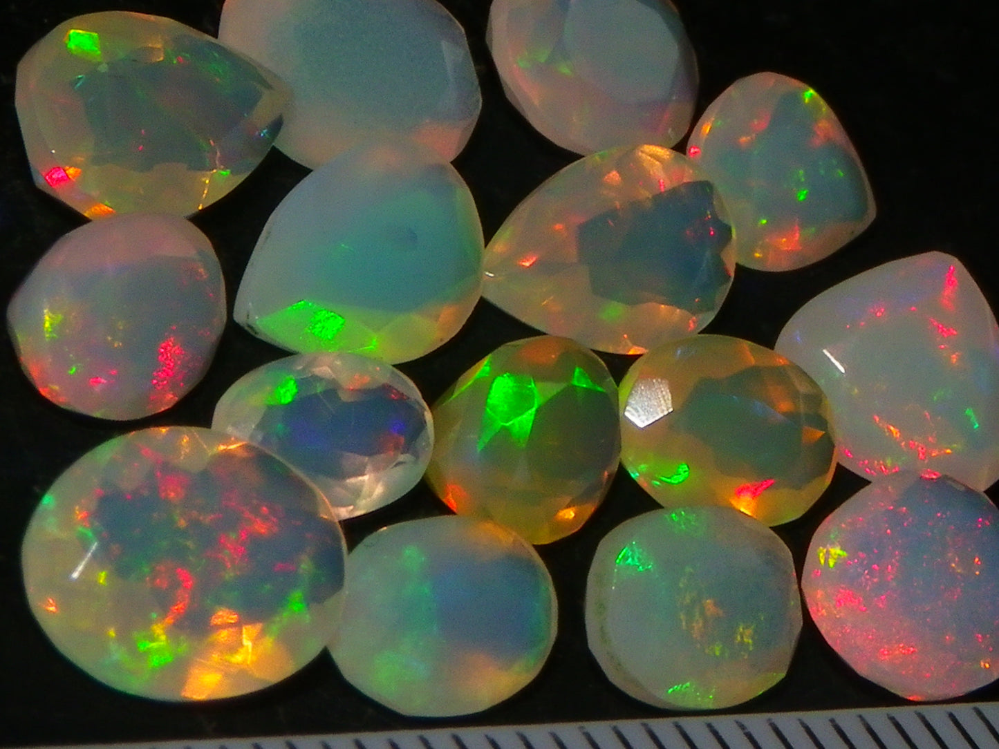 Nice Parcel Faceted/Cut Welo Opals 9cts 15 stones Multicolour Fires Mixed shapes