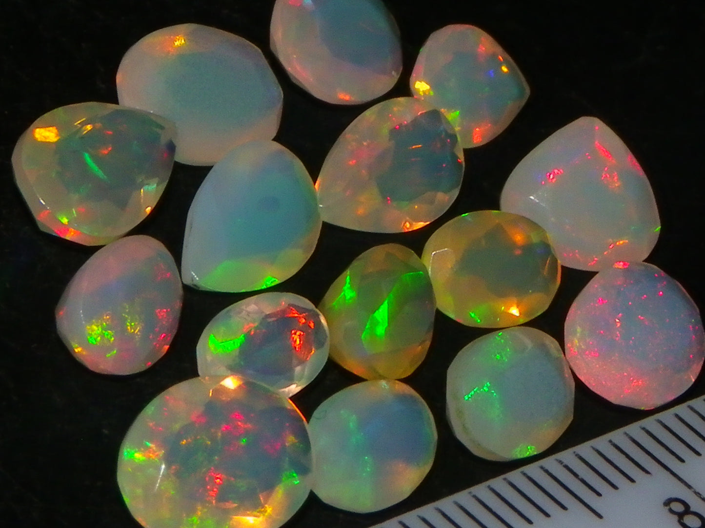 Nice Parcel Faceted/Cut Welo Opals 9cts 15 stones Multicolour Fires Mixed shapes