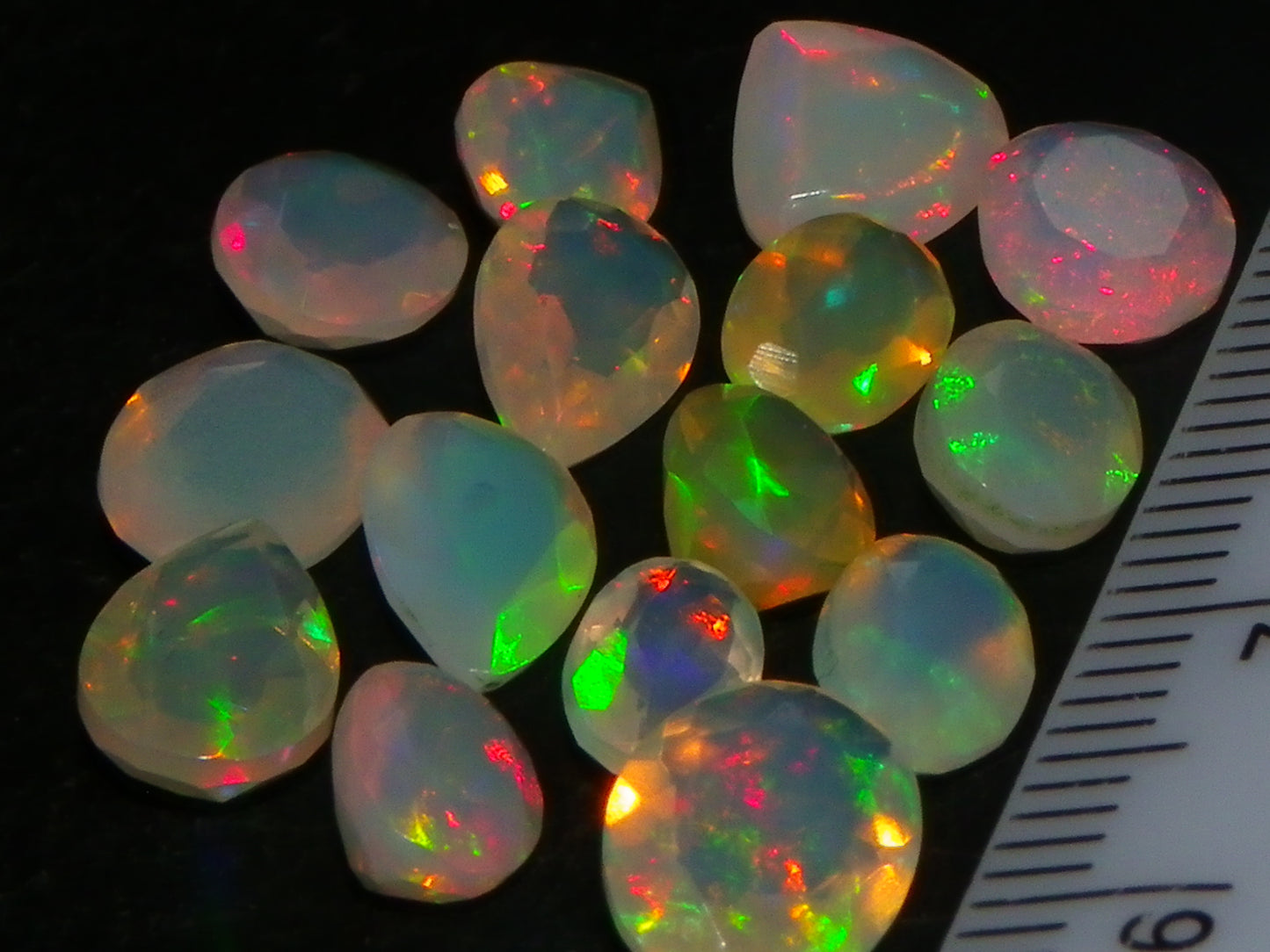 Nice Parcel Faceted/Cut Welo Opals 9cts 15 stones Multicolour Fires Mixed shapes