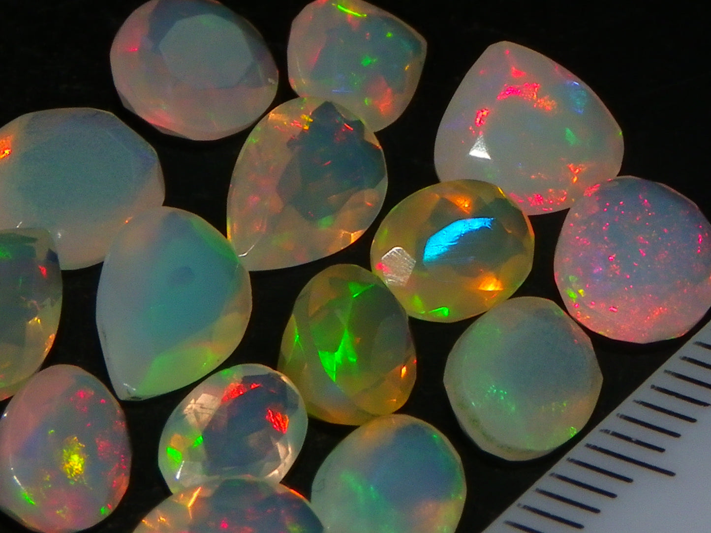 Nice Parcel Faceted/Cut Welo Opals 9cts 15 stones Multicolour Fires Mixed shapes