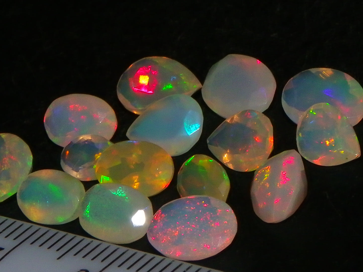 Nice Parcel Faceted/Cut Welo Opals 9cts 15 stones Multicolour Fires Mixed shapes