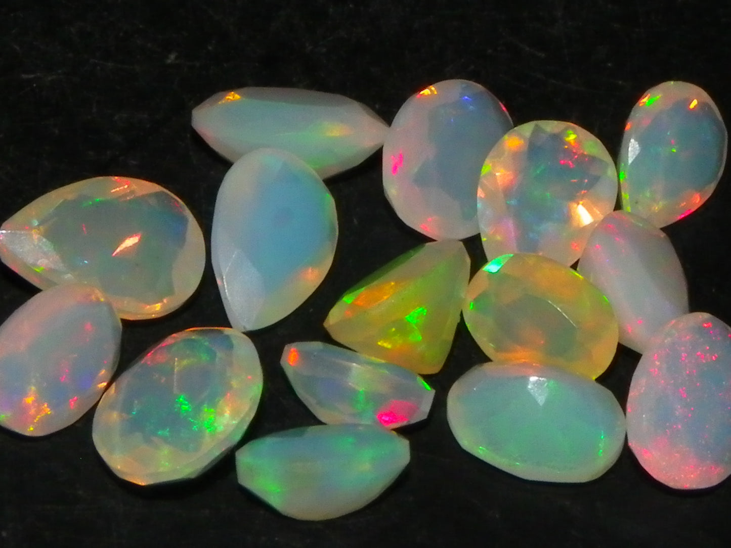 Nice Parcel Faceted/Cut Welo Opals 9cts 15 stones Multicolour Fires Mixed shapes