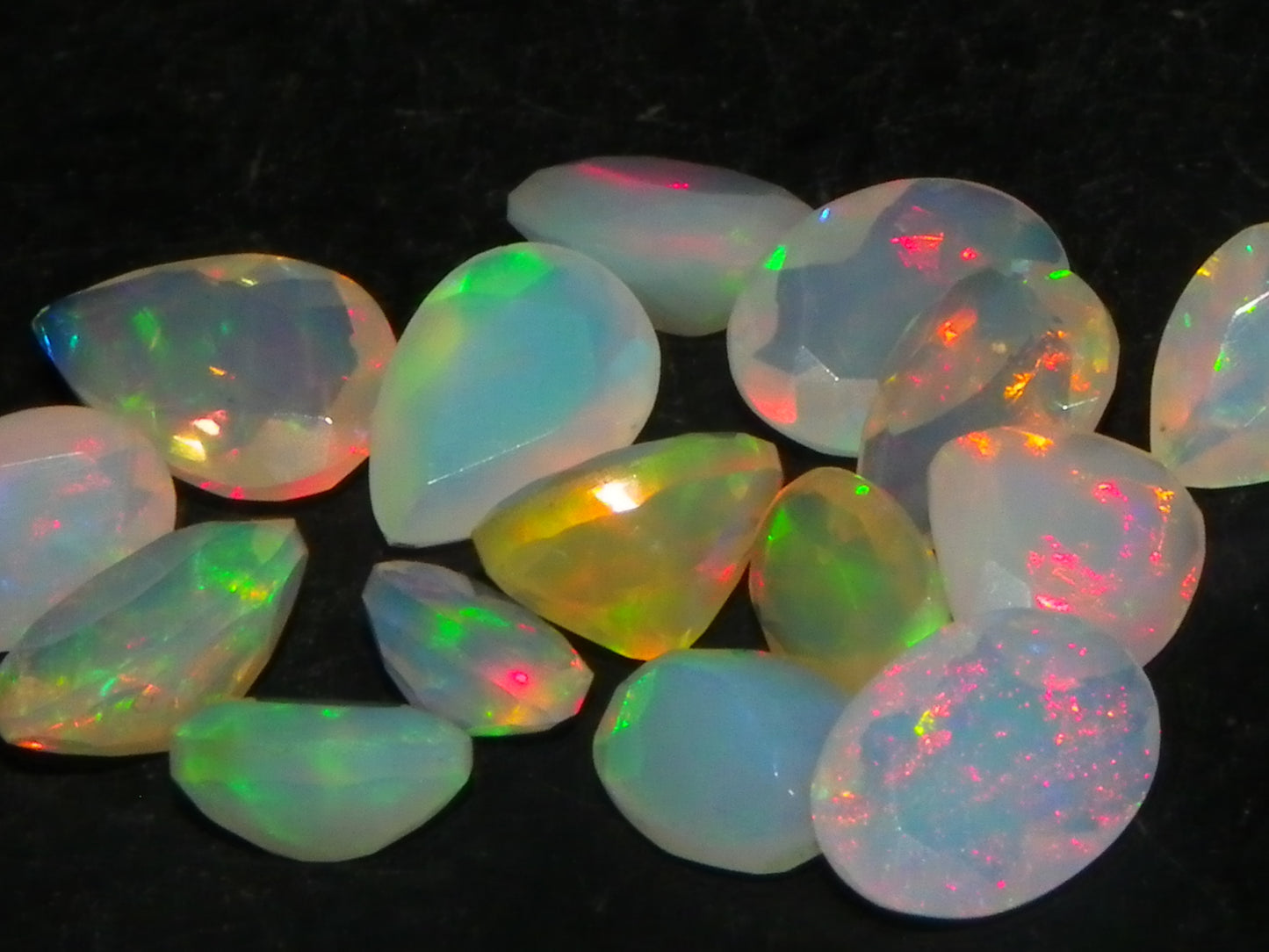 Nice Parcel Faceted/Cut Welo Opals 9cts 15 stones Multicolour Fires Mixed shapes