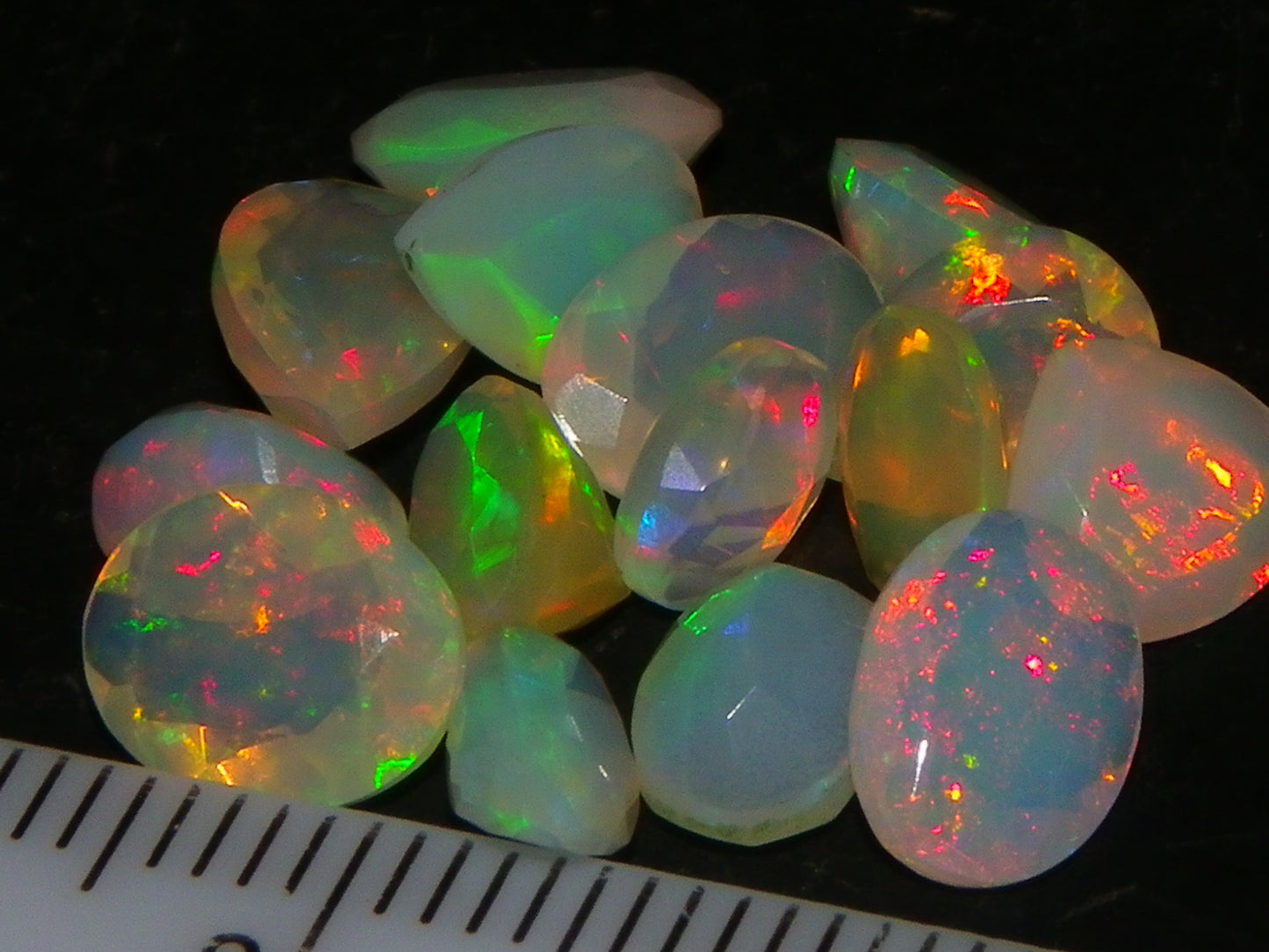 Nice Parcel Faceted/Cut Welo Opals 9cts 15 stones Multicolour Fires Mixed shapes