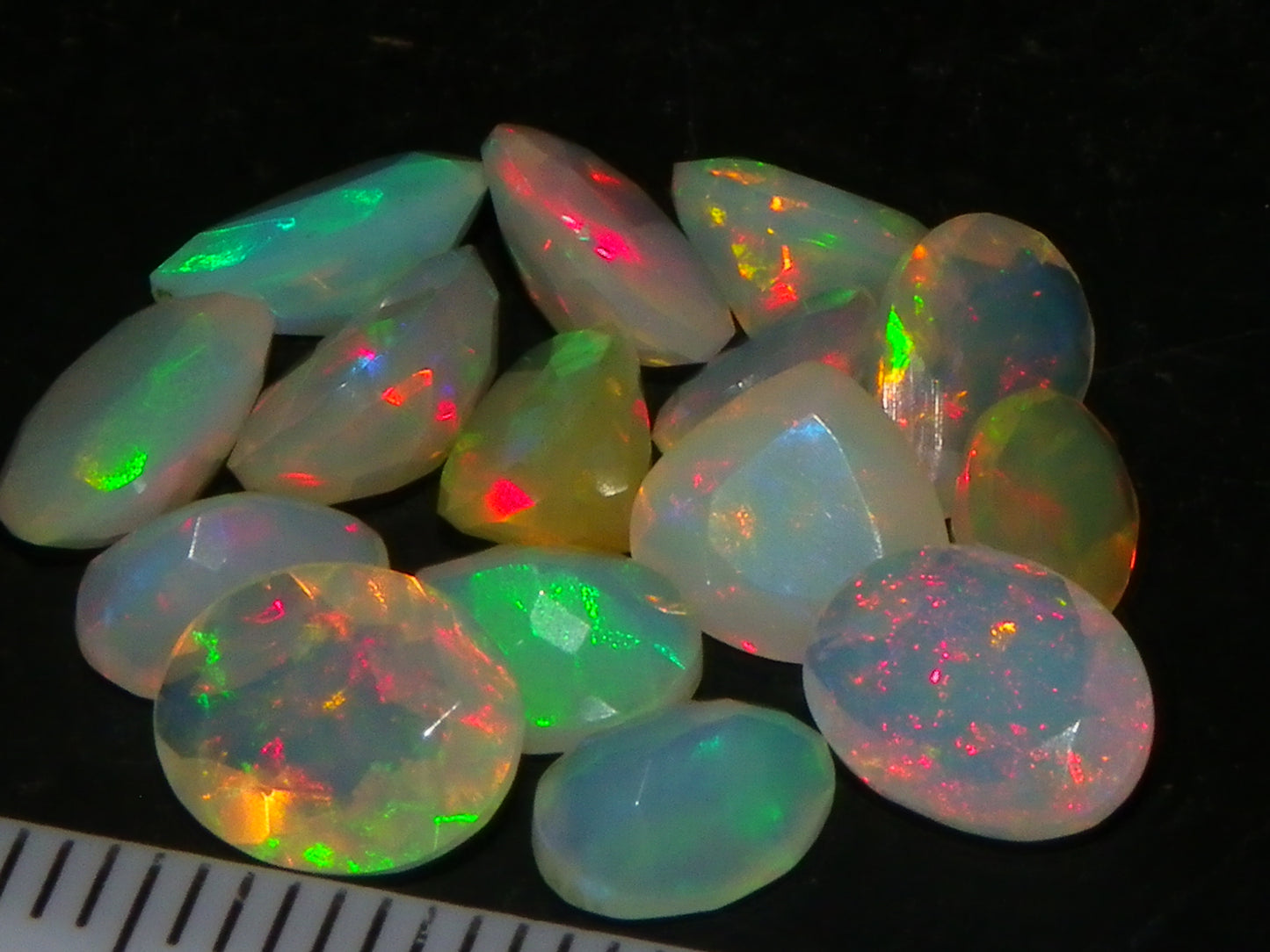 Nice Parcel Faceted/Cut Welo Opals 9cts 15 stones Multicolour Fires Mixed shapes