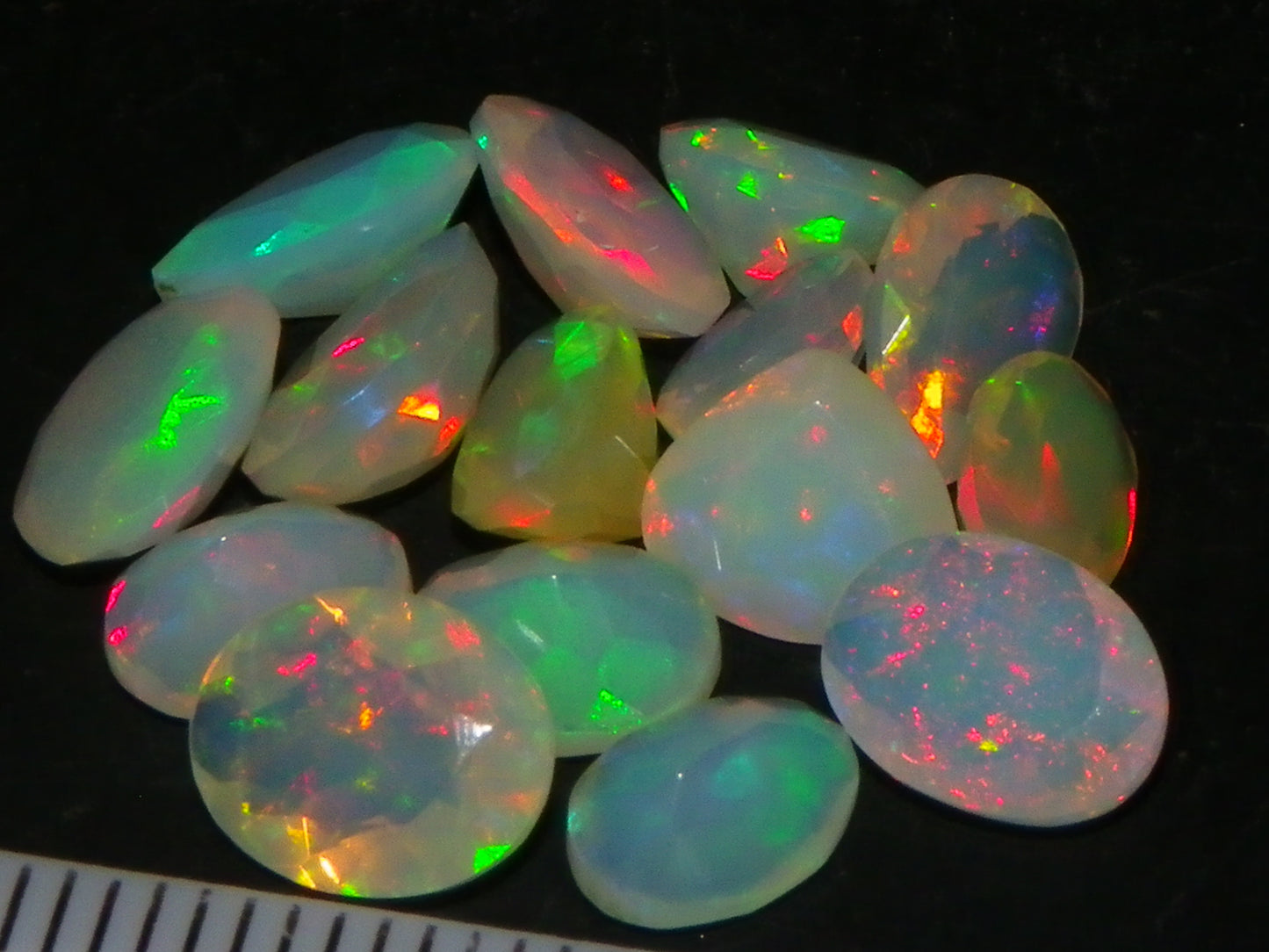 Nice Parcel Faceted/Cut Welo Opals 9cts 15 stones Multicolour Fires Mixed shapes